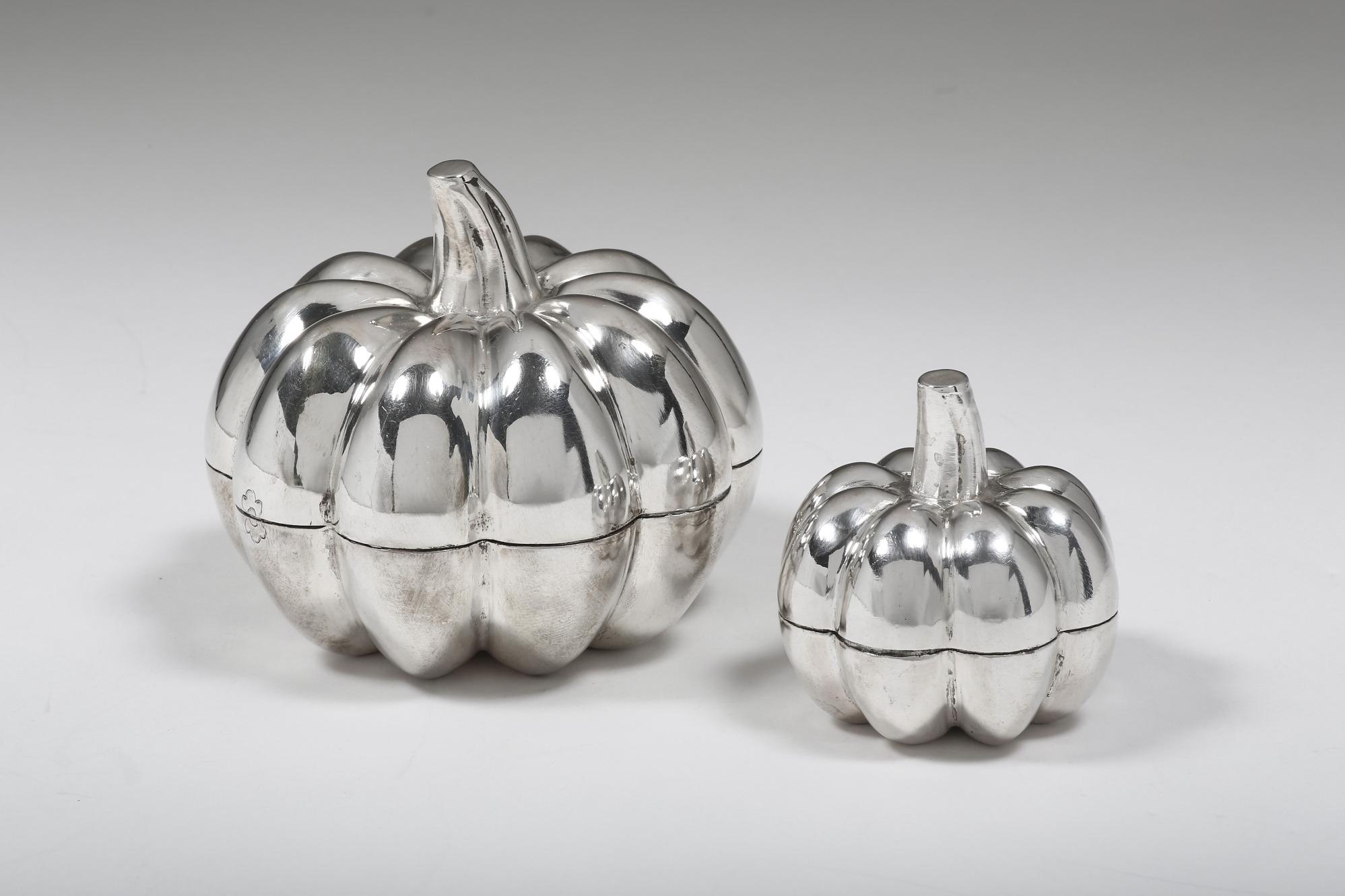 The contemporary solid silver pumpkin set of two is handcrafted by experienced silversmiths with fine techniques. They make perfect decorations for dinner tables and all kinds of events suitable. The pumpkins are designed to be opened for storage