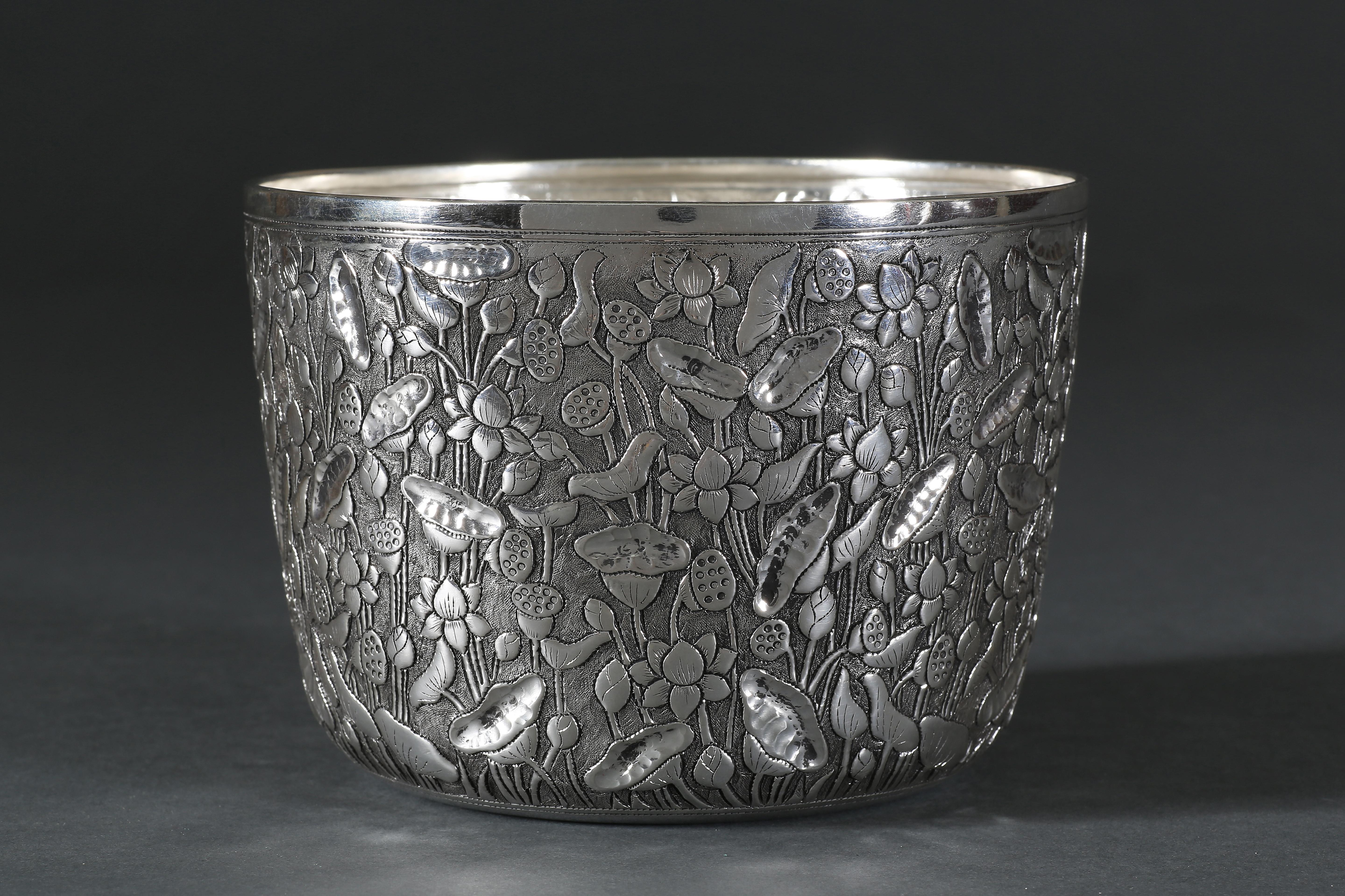 Designed in-house, this bowl is part of our unique collection of contemporary solid silver pieces, hand-worked by our team of talented Southeast Asian silversmiths. The fine Chinoiserie bowl is meticulously chased with lotus pond motif. 
The silver