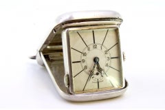 Hand-wound travel clock in guilloche silver on the casing and suspension ring