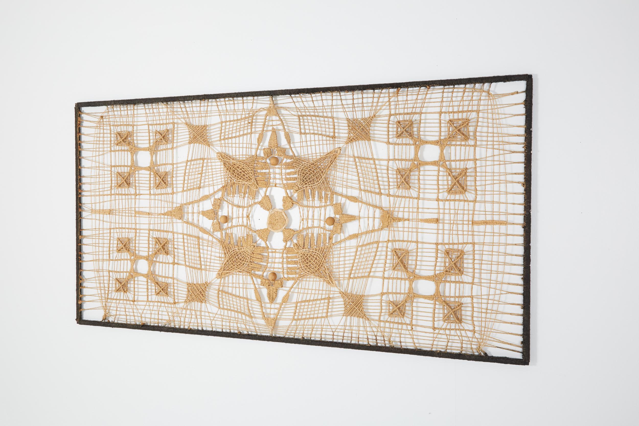 Woven; Wall piece; Artwork; Mid-Century Modern; Tapestries; Contemporary Art; Craftsman

This Hand-woven wall piece is a true conversation piece. The depth is created by layering different patterns on top of each other in a frame. The wall behind