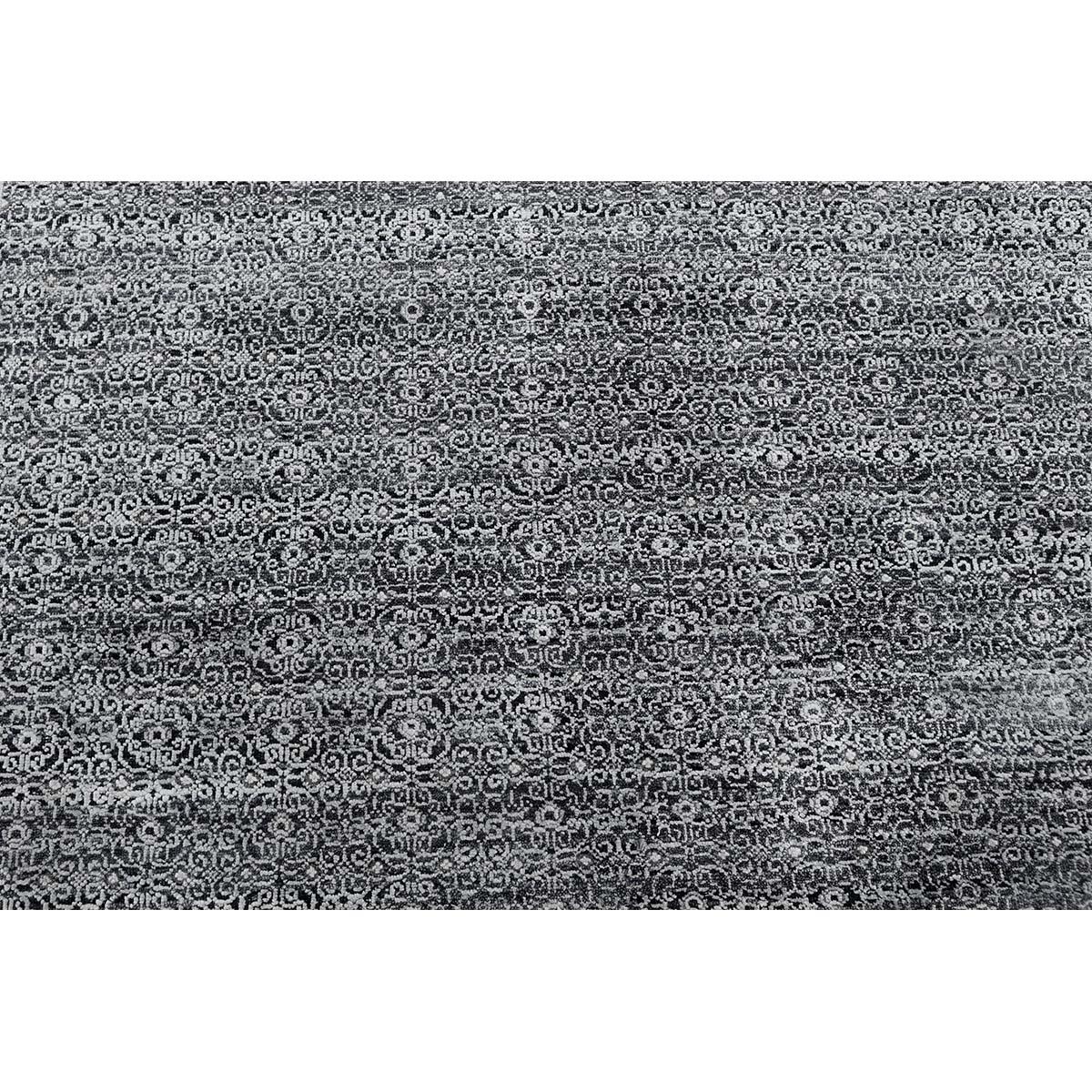 This elegantly hand woven rug is from India and woven from the finest wools and silks to create a soft and luxurious piece that will work well in so many different settings. Measures: 6'x9'.
 