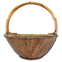 Hand-Woven Rattan and Reed Basket with Handle and Braided Border