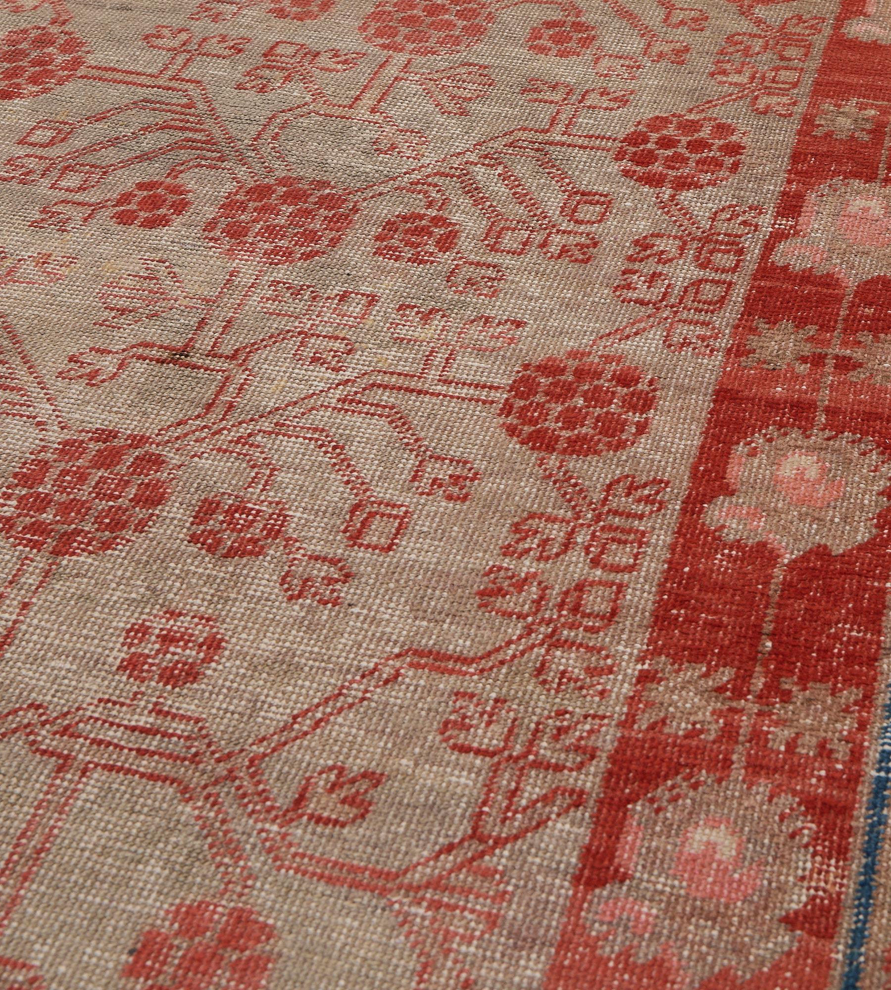 Hand-woven Wool Antique Red Pomegranate Floral Khotan Runner In Good Condition For Sale In West Hollywood, CA