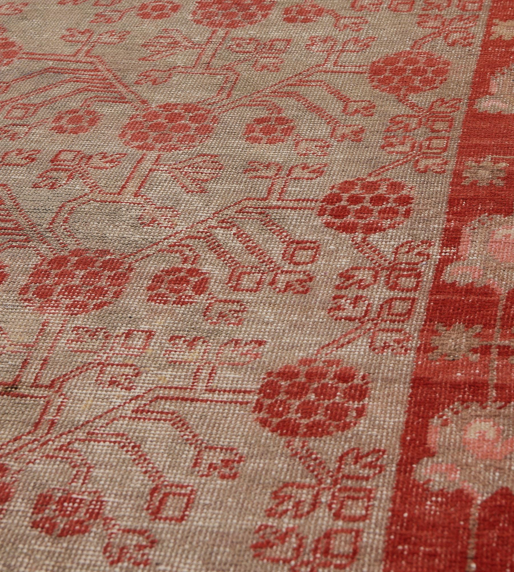 19th Century Hand-woven Wool Antique Red Pomegranate Floral Khotan Runner For Sale