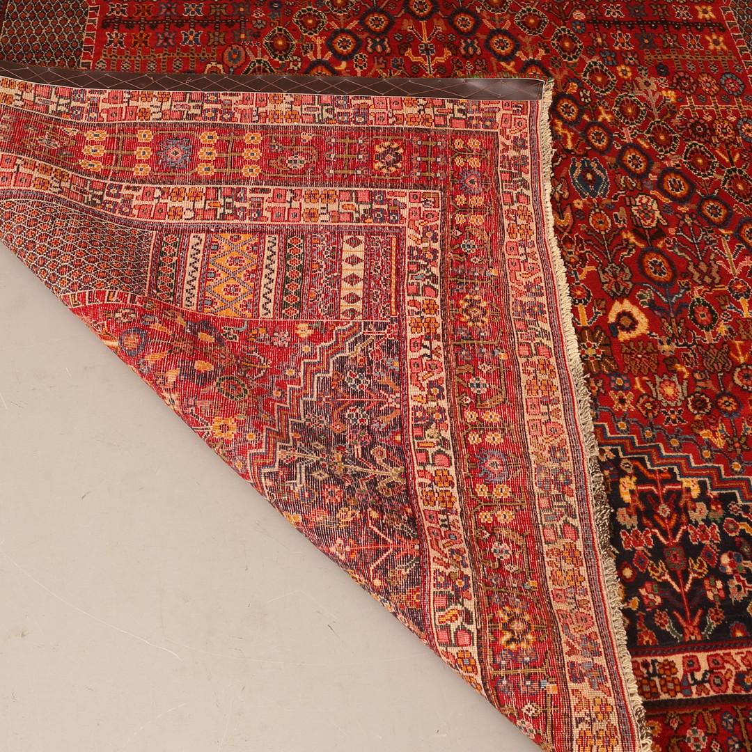 Handmade Caucasian carpets are some of the most desirable among rustic rugs due to their decorative aesthetic with unique and spatial variations of all-over Nazemi designs and decorative borders. This piece was woven by hand and featured a