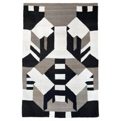 Hand-woven wool rug "Flattened City B" by Maria Sanchez