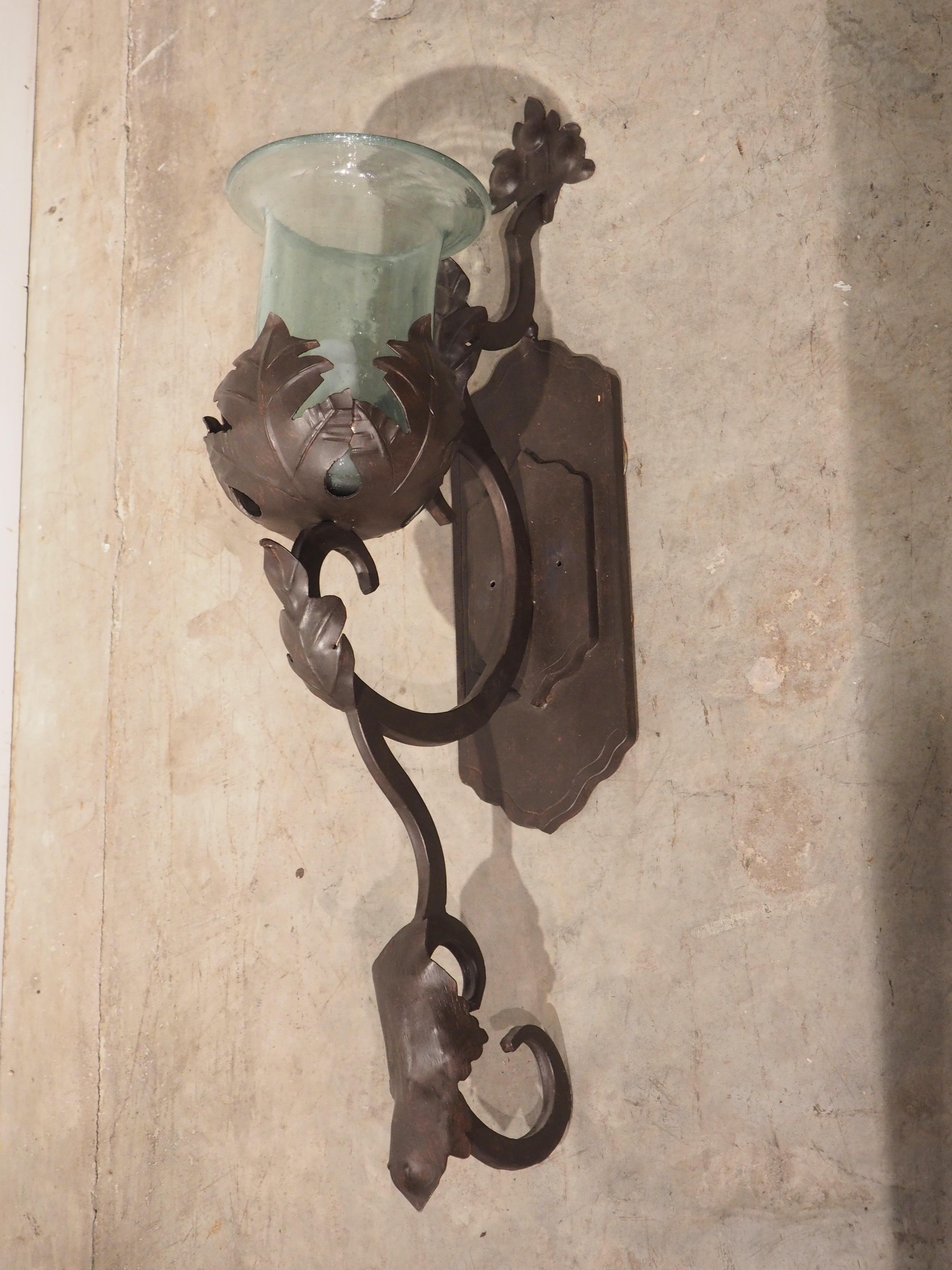 American Hand Wrought Iron and Glass Wall Sconce with Foliate Motifs For Sale