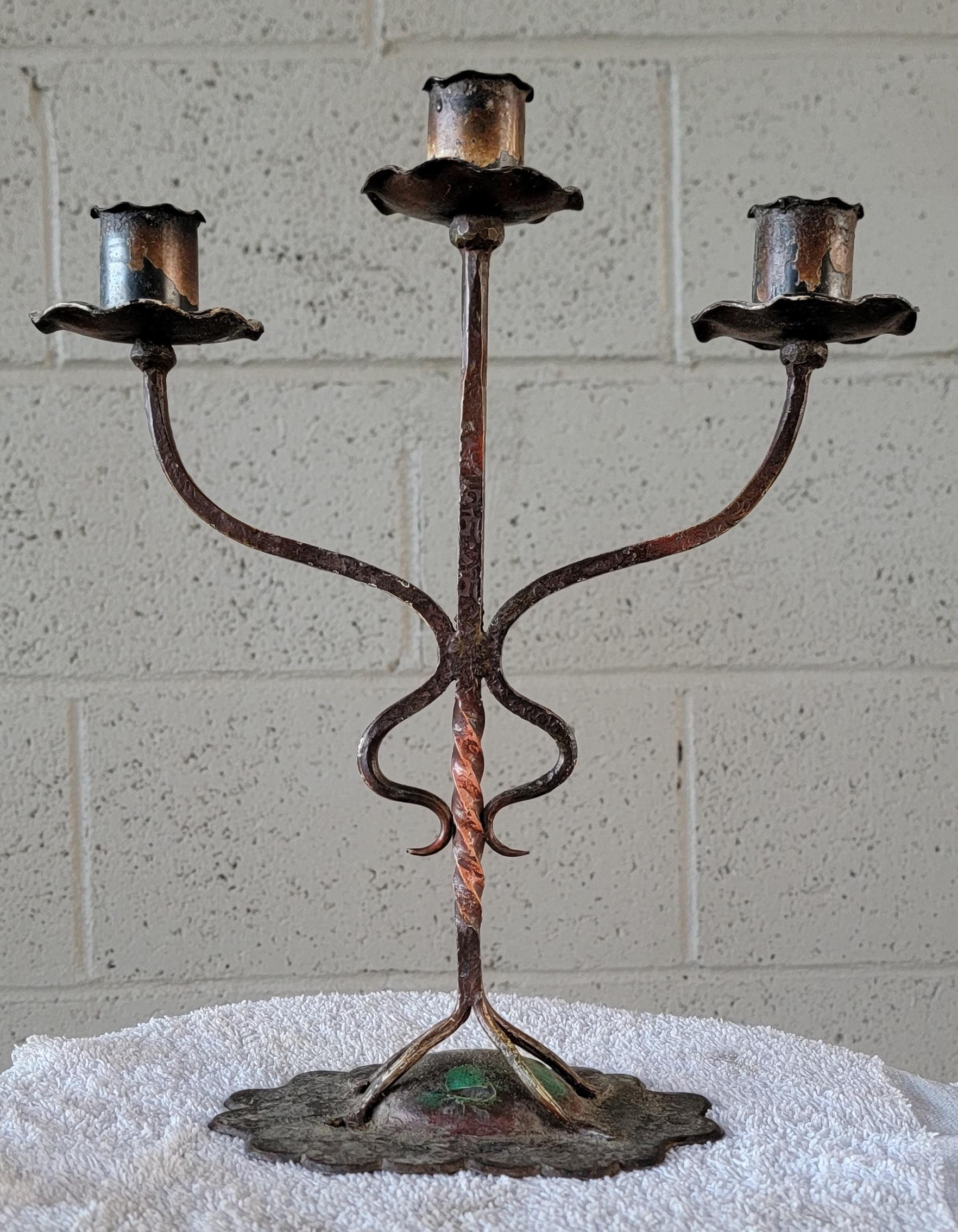 1920's hand wrought iron candlestick. Arts & Crafts era being a perfect blend with Mission Oak furniture. Original painted details. Fine craftsmanship and proportion. In the manner of Rembrandt Lamp Company.