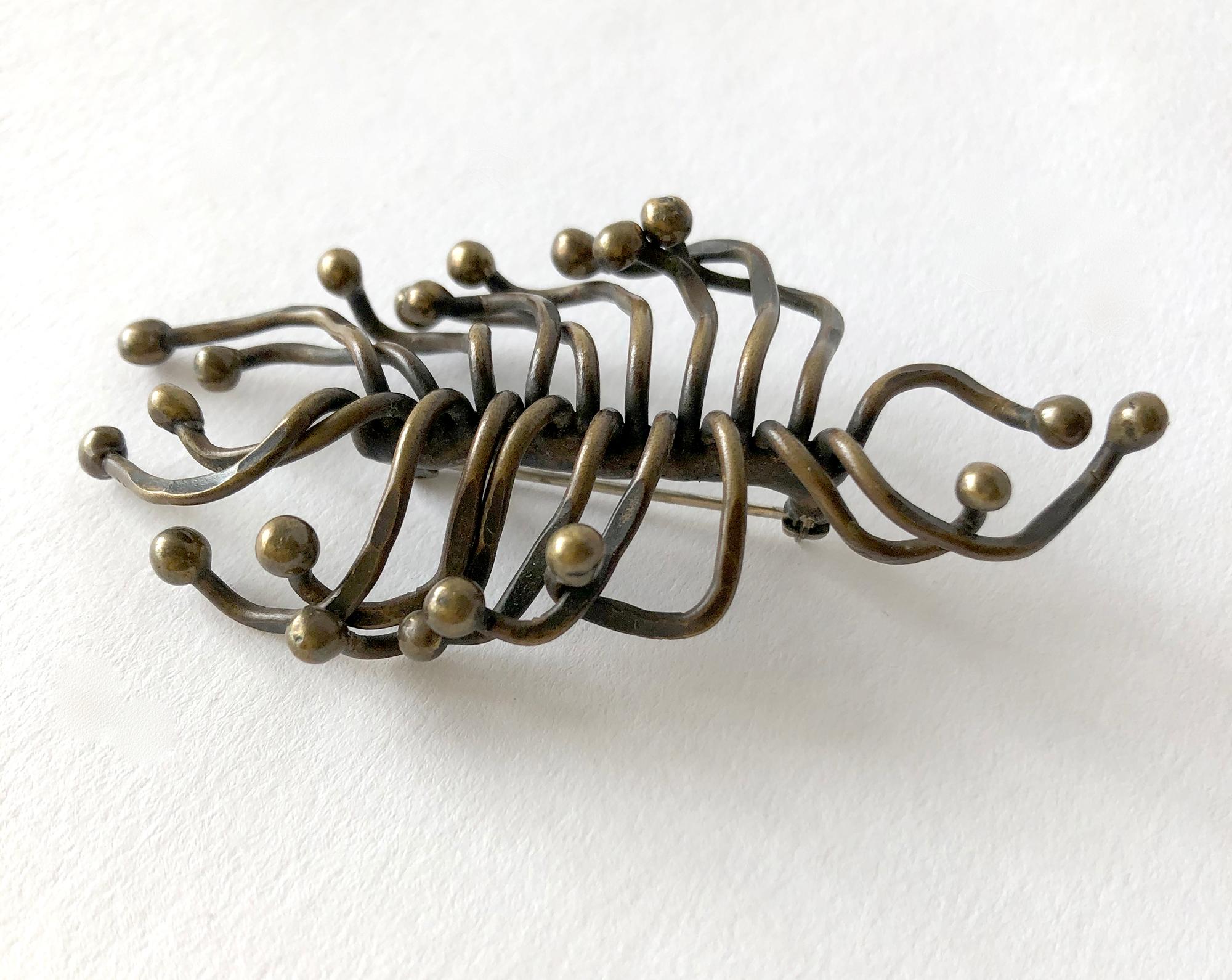 Sculptural, hand wrought brooch in organic form.  Brooch measures 1 1/2