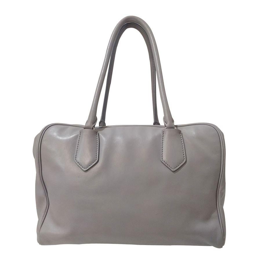 Year 2015 Soft calf leather Light grey and mint green color Two leather handles The first zip opens on two side compartments and a central green leather clutch The second zip opens the central compartment that has inside a zip pocket and two