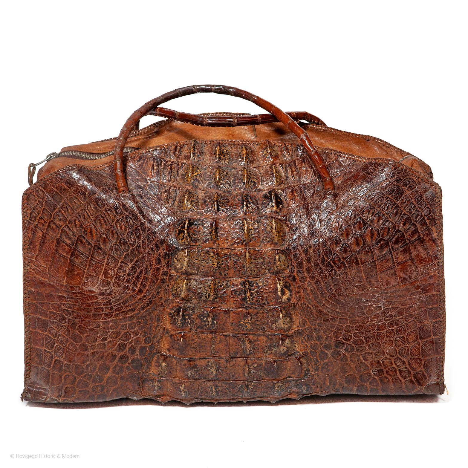 Crocodile hornback overnight bag or large handbag with exceptional, deep and richly pigmented scales. Made from one skin with complete osteoderms (back scales) wrapping from front to back with outstanding rich, colouring and depth and patterning.