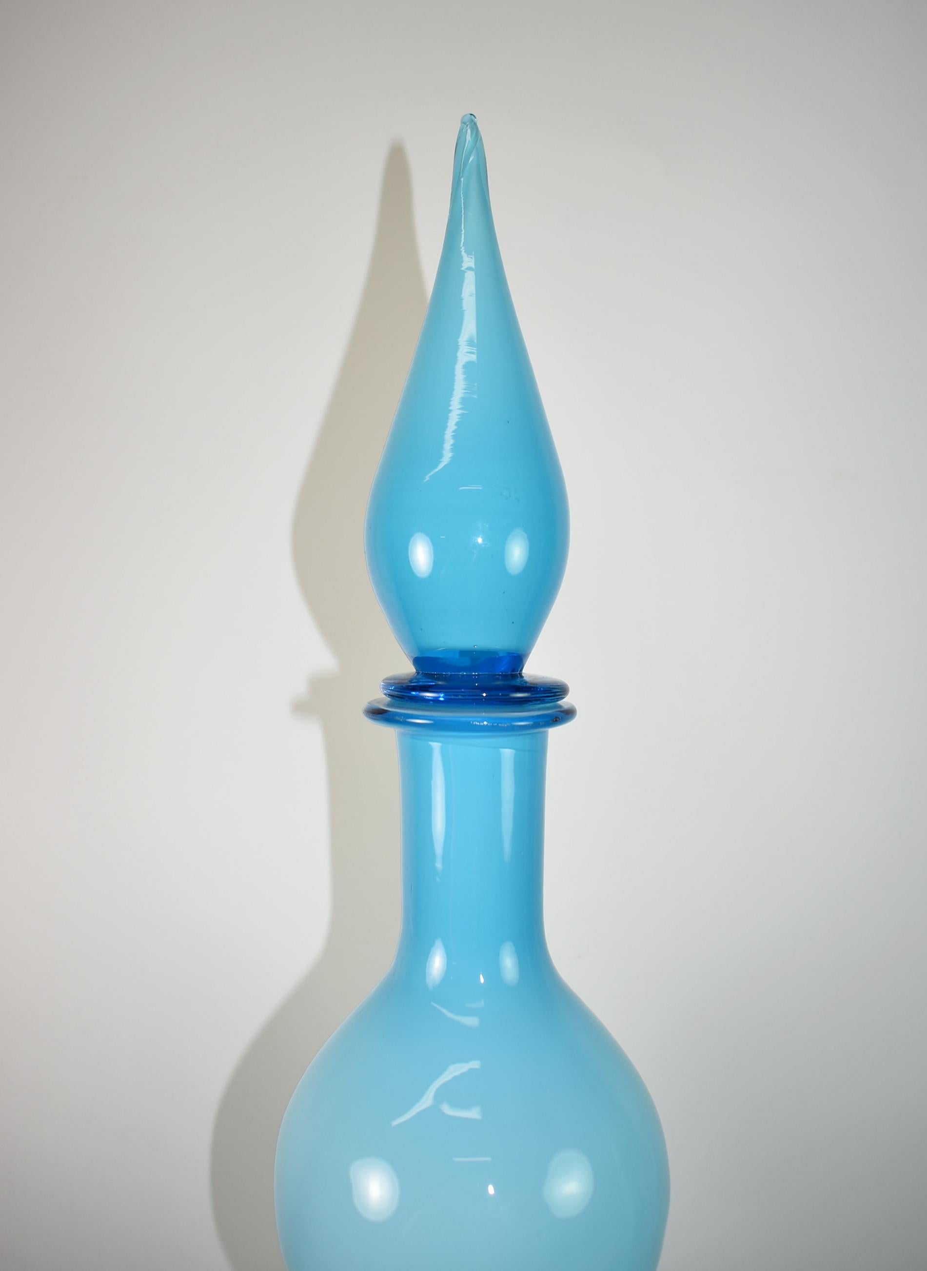Vintage aqua blue hand blown glass, Empoli Italian decanter, three waves, Murano, Mid-Century circa 1950-60s. White interior with blue cased glass with a teardrop stopper. Very good condition with light scratch on edge of bottom face. Dimensions: