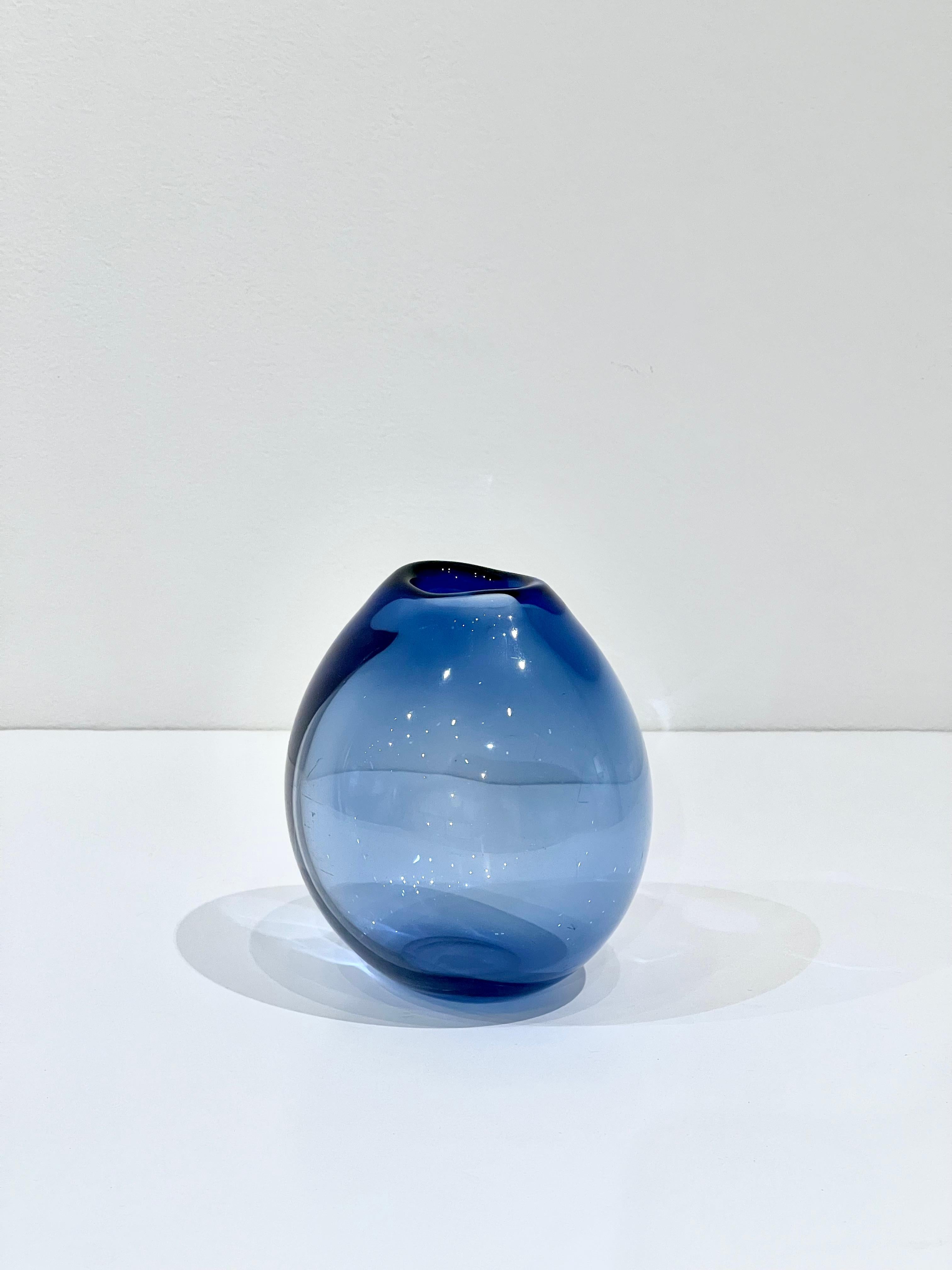 Small Handblown blue glass vase by Per Lutken for Holmegaard. Made in Denmark, circa 1960's. Signed on the bottom.