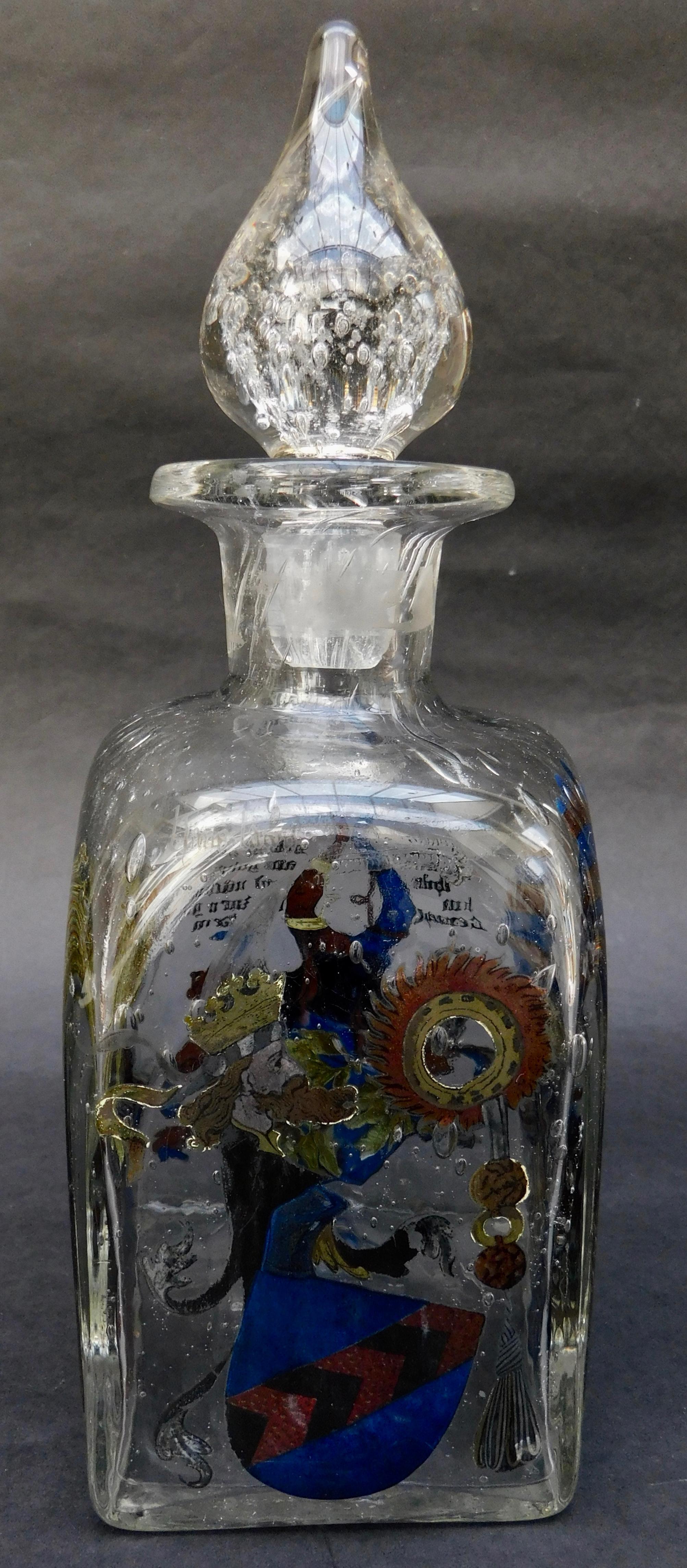 Vintage handblown continental glass decanter with painted enamel heraldic arms decorations. Each side has a different decoration, circa 1920.