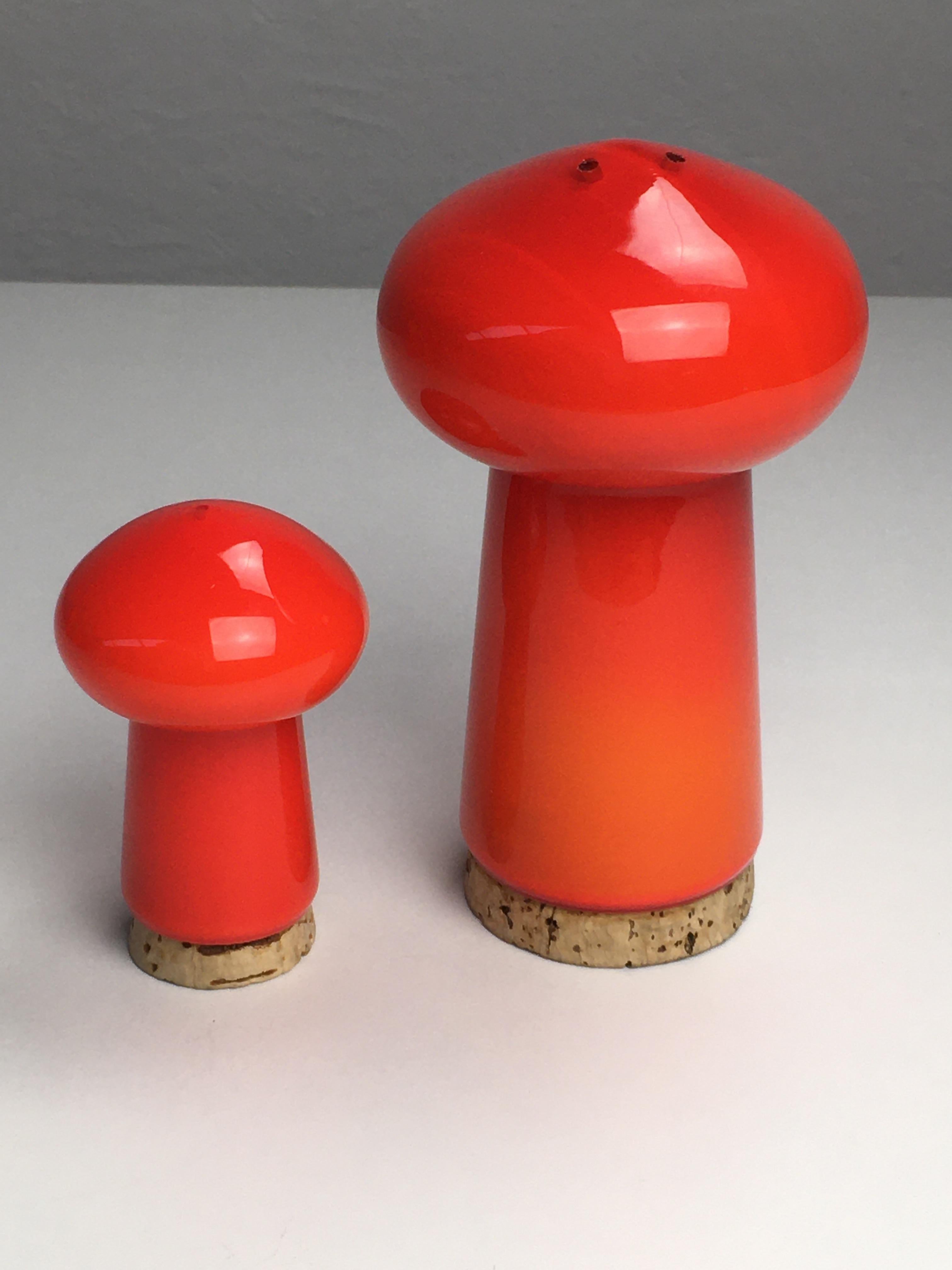 Set of Danish salt and pepper set in handblown red mushroom shaped opalineglass, designed by Michael Bang and produced by Holmegaard in the 1970s.

The well designed hand blown mushroom shaped set in 3 layer opal glass with it´s 1970´s colors is