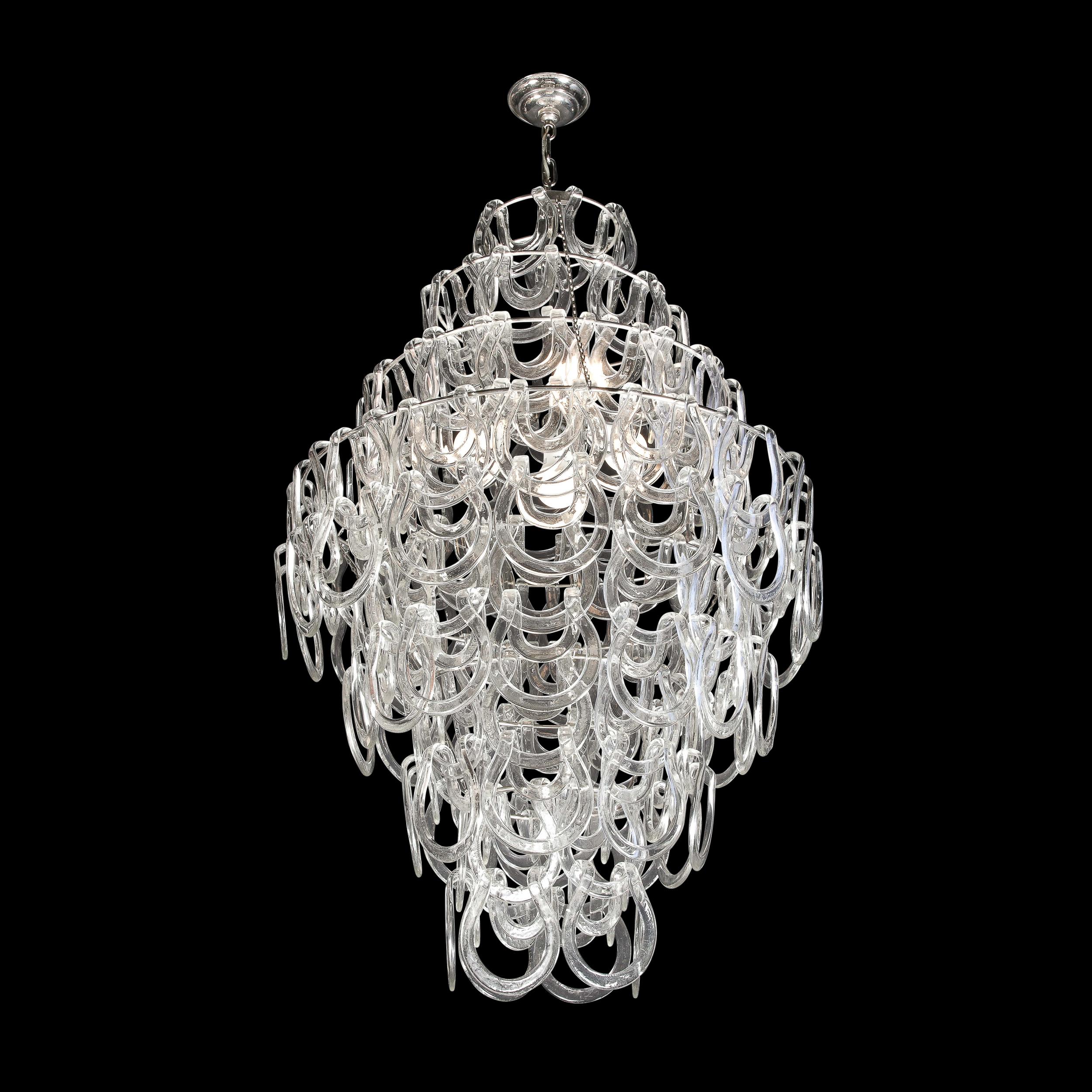 This elegant and sophisticated Giogali 'Link' Chandelier was realized by the legendary designer Angelo Mangiarotti for Vistosi, circa 1960. Created in Murano, Italy- the island off the coast of Venice renowned for centuries for its superlative glass