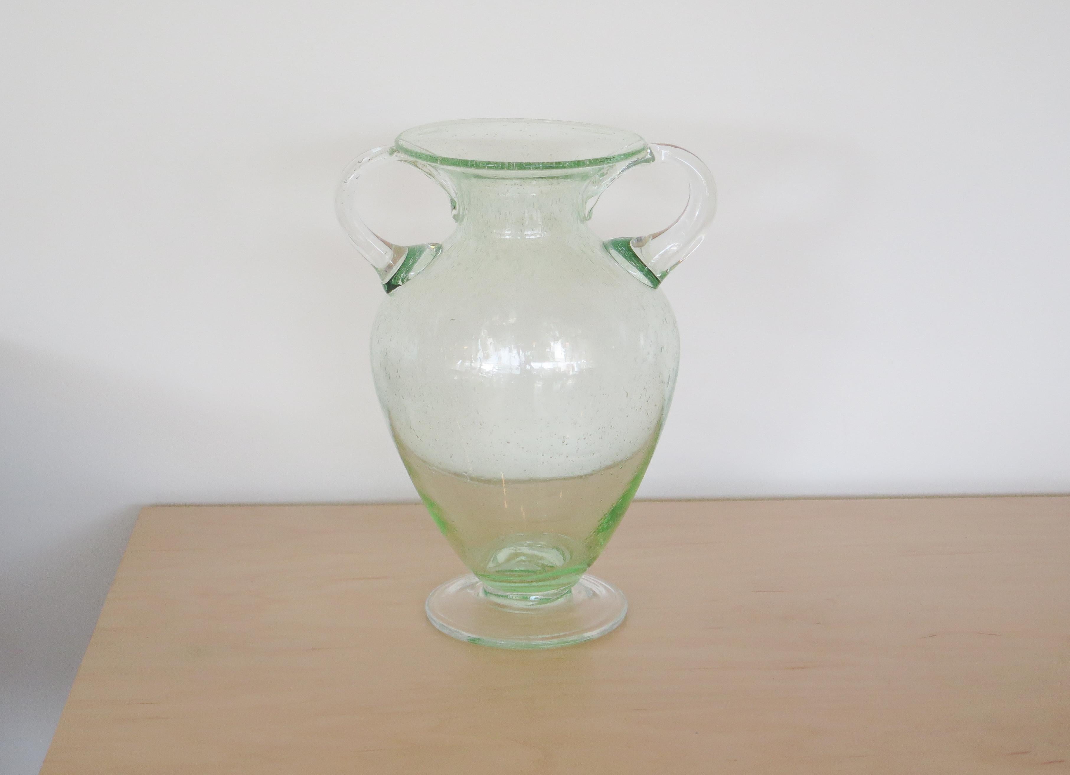 Vintage hand blown glass vase from Murano, Italy in a translucent sea foam green. Beautiful urn shape with two handles. Excellent vintage condition.