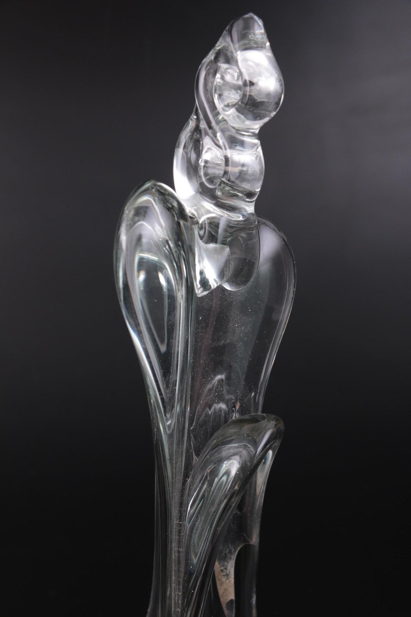 Introducing the exquisite Handblown Studio Art Glass Sculpture by renowned artist John Bingham, a highly collectible piece that exudes timeless elegance. Crafted in the USA back in 1976, this captivating work of art showcases the unparalleled skill