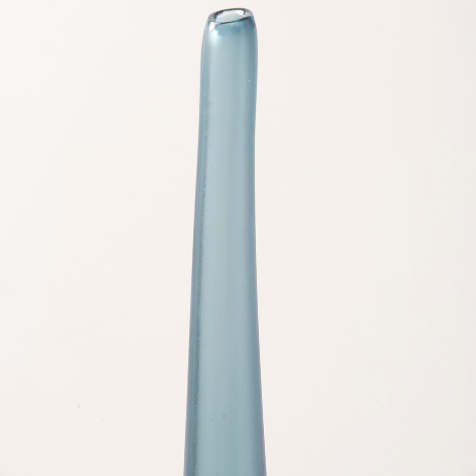 Designed and signed by artist Laura de Santillana for Arcade Murano glass, handblown vase is #221 from a limited edition of 300. Just under two feet tall, this narrow vase is wisteria blue. New, limited edition with no flaws found.