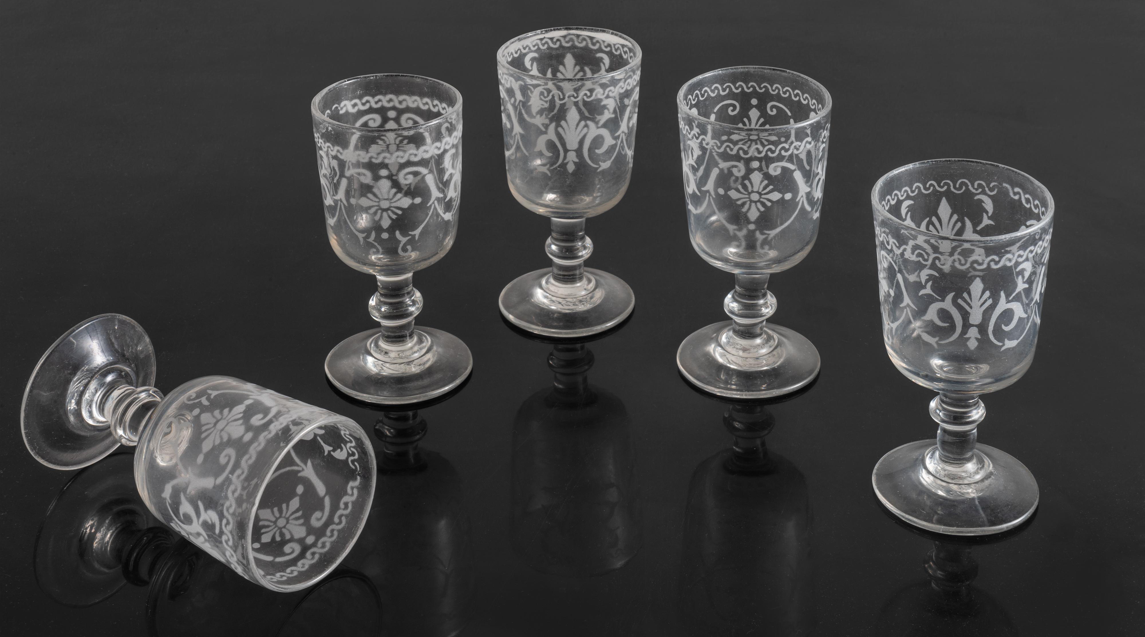 Series of five glasses, with sandblasted decorative motifs. Each glass is hand blown so small differences are present.