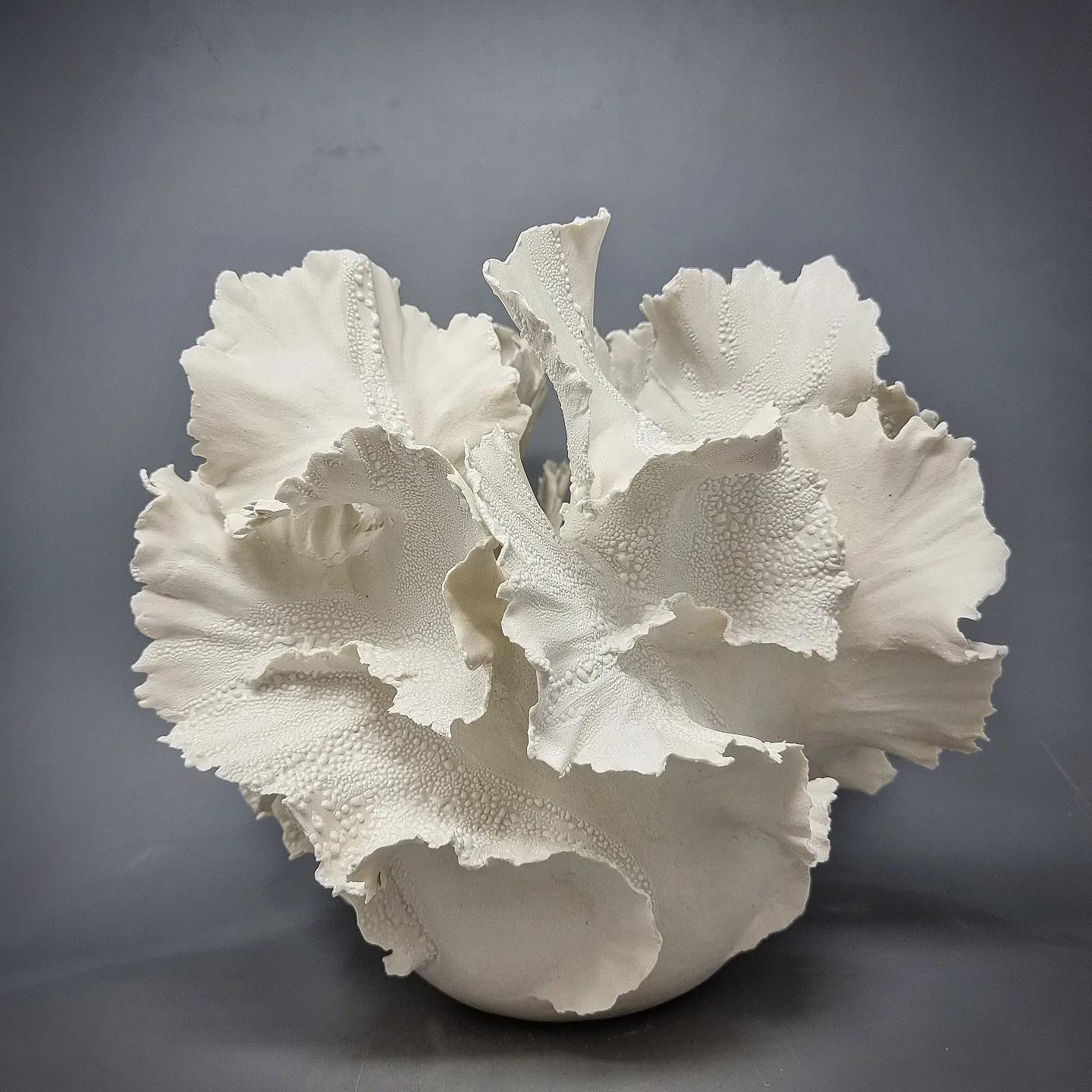 Handbuilt paperporcelain sculpture in shape of a vase. This is from the 