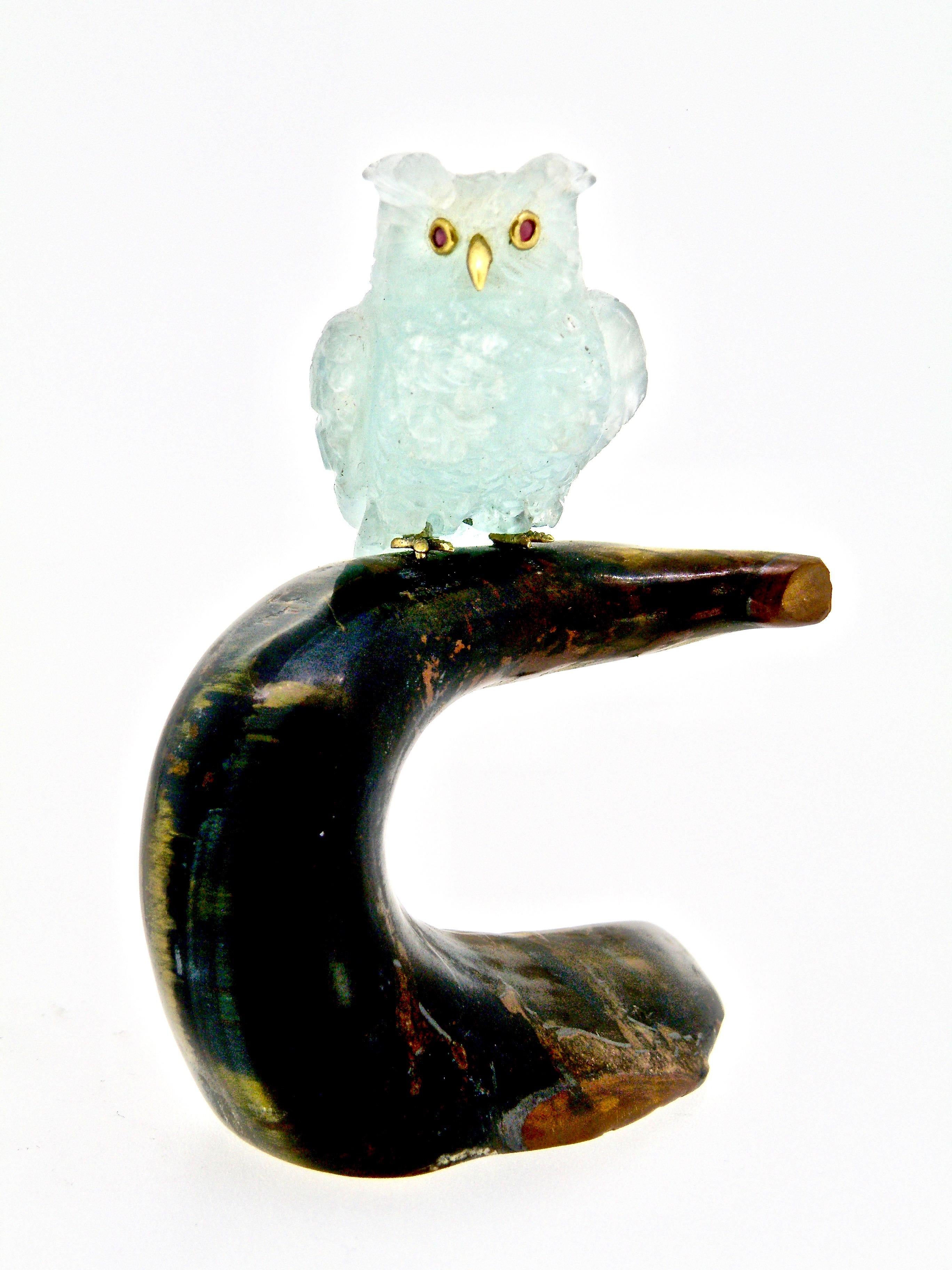 Owl on a roost Aqua handcarved owl sitting on petrified palm base approximately 5” high and 6” wide