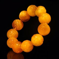 Hand‑Carved Asian Symbolic Amber Beaded Bracelet