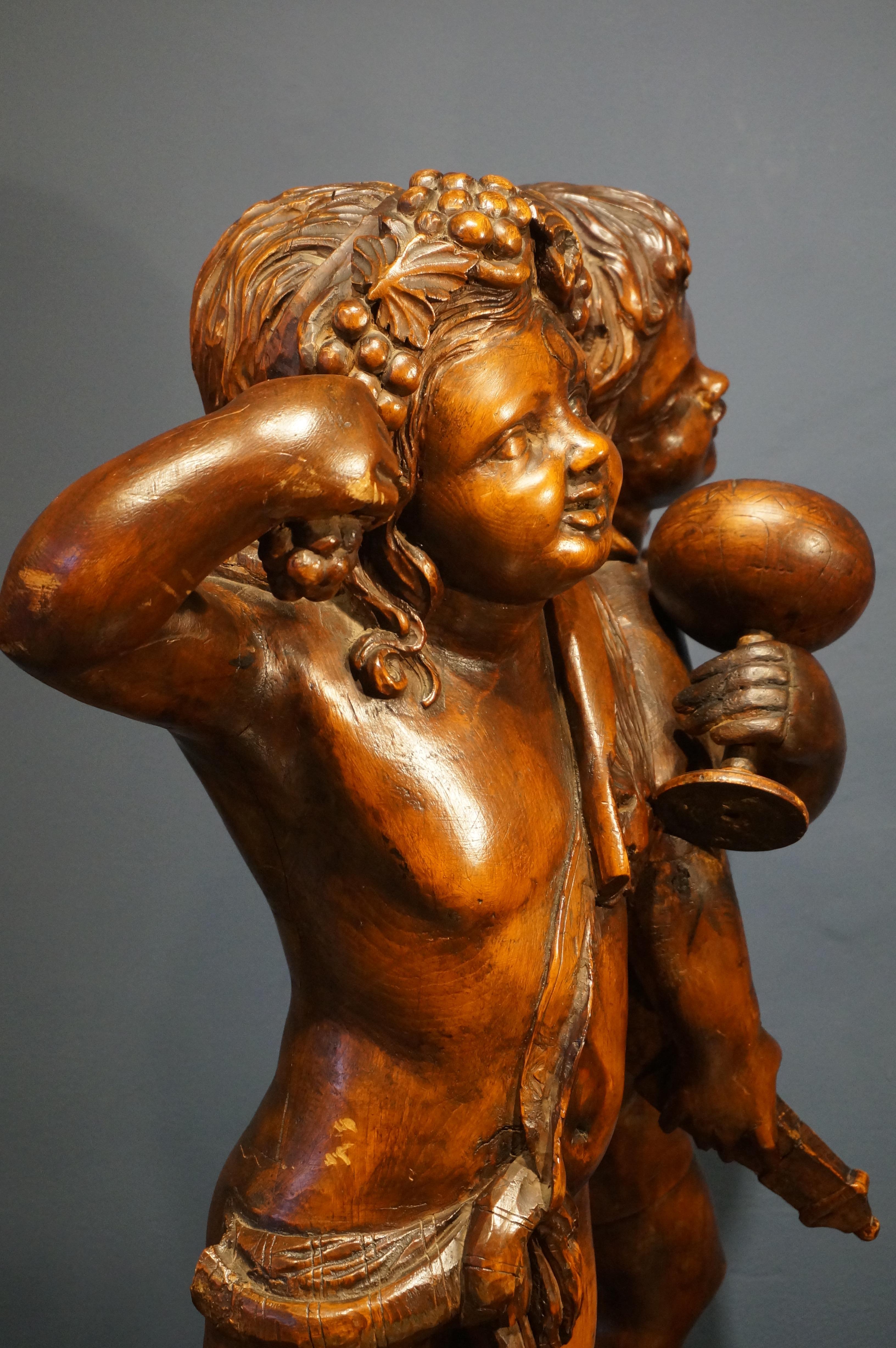 Handcarved baroque wooden sculpture depicting Bacchus and Amor, 18th century For Sale 1
