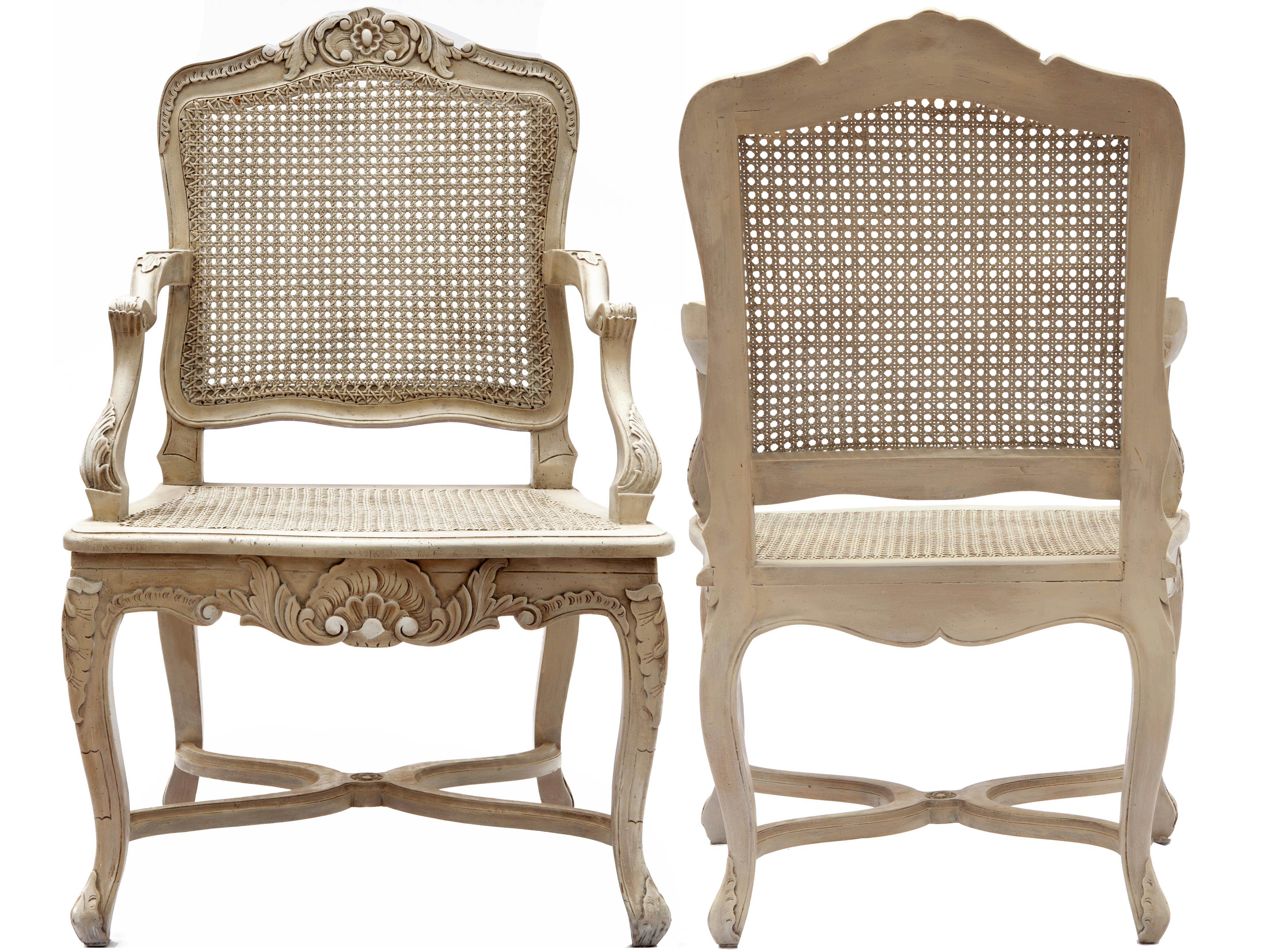 Early 20th Century Italian hand carved and caned armchairs. The natural cane back and seats have been stripped to a nude finish. The chairs are in excellent condition with little to no wear. Some difference in the cane coloring.
Intact strong and