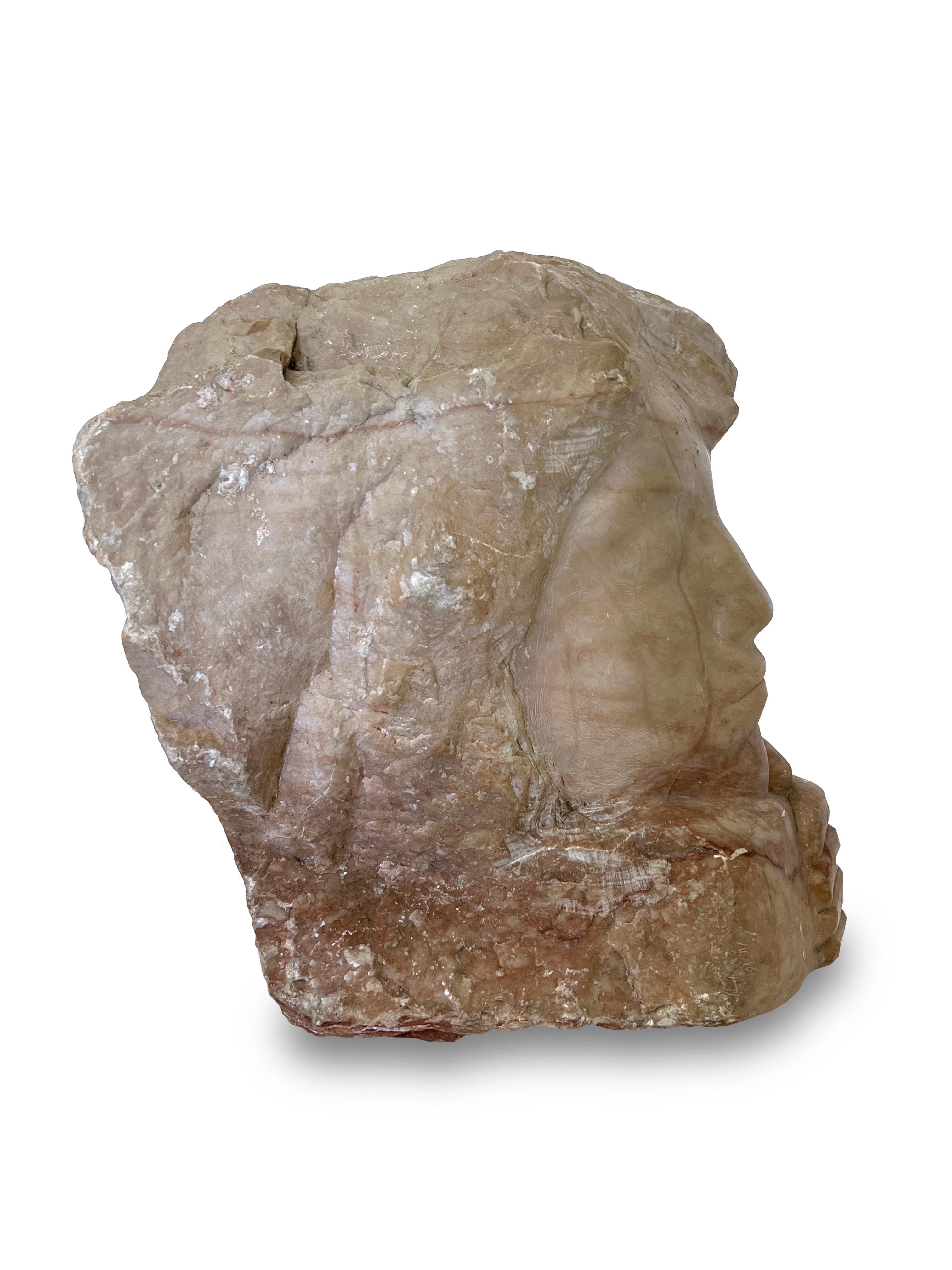 Beautiful hand carved face sculpture of a woman. This piece was carved on a rought cut piece of marble leaving the natural beauty of the material. A great accent piece for any room. 

Property from esteemed interior designer Juan Montoya. Juan