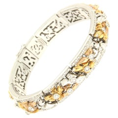 Bracelet manchette artisanal en or blanc et jaune 18 carats avec diamants