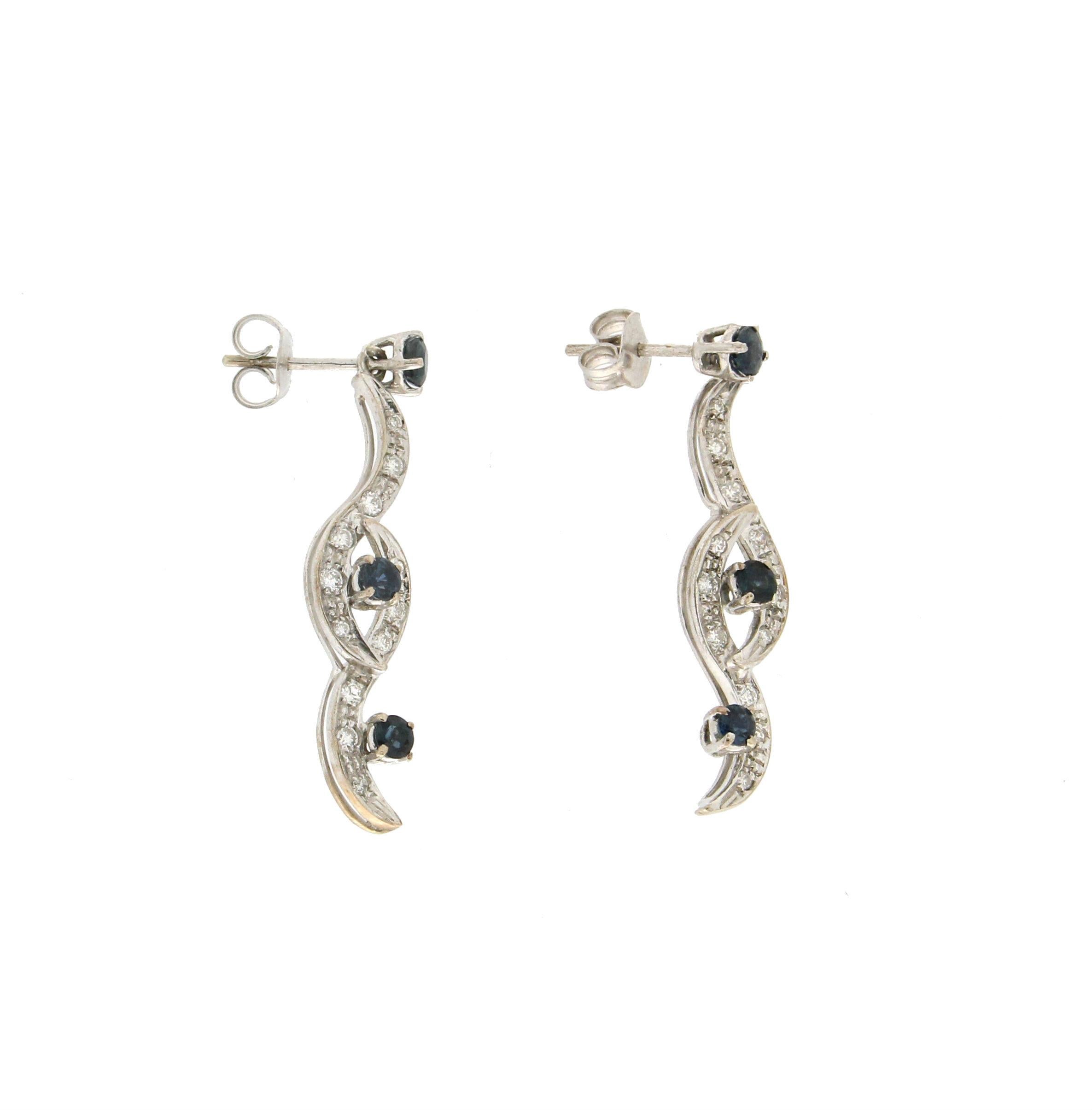18 karat white gold drop earrings. Handmade by our artisans and assembled with sapphires and diamonds.

Sapphires weight 1.14 karat
Diamonds weight 0.40 karat
Earrings total weight 5.60 grams