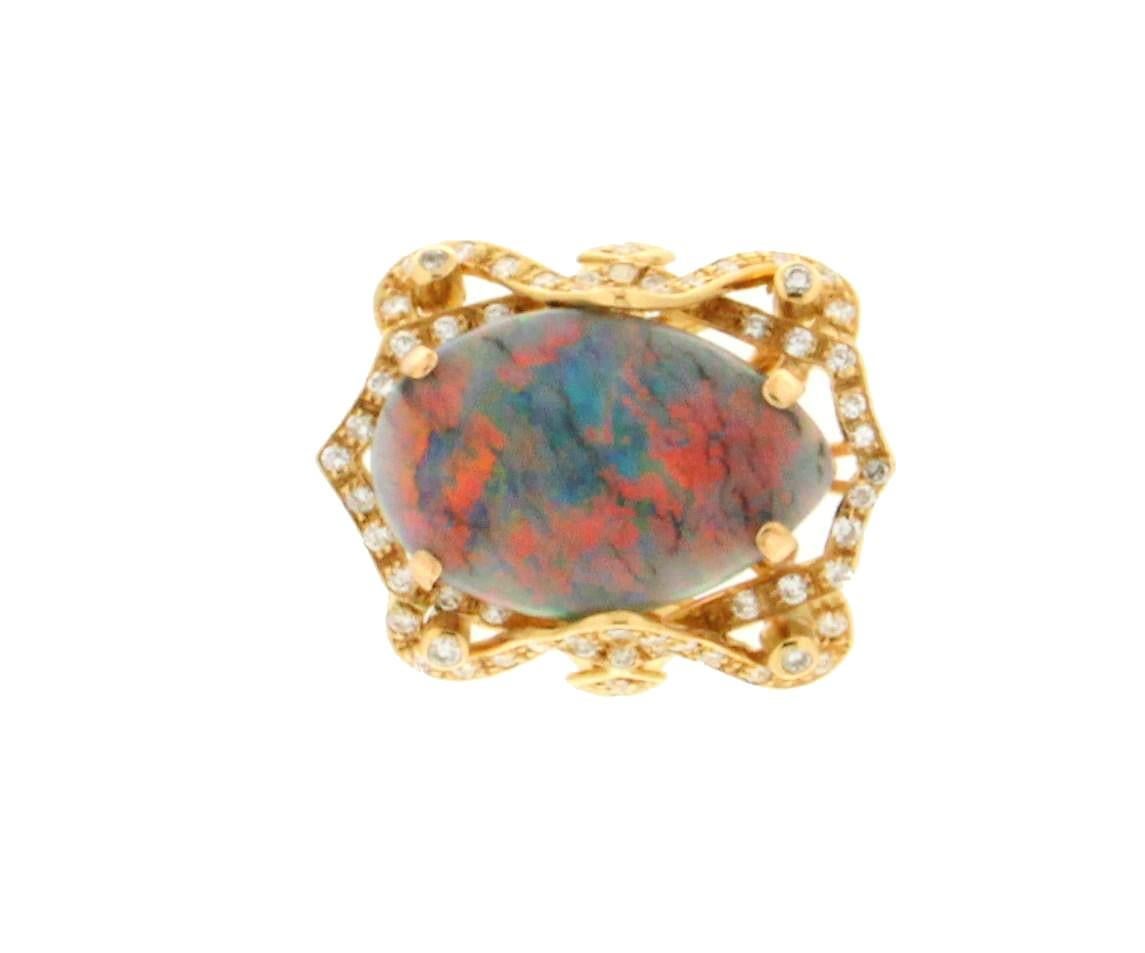 18 karat yellow gold cocktail ring. Handmade by our artisans assembled with diamonds and Australian opal

Ring total weight 9.60 grams
Diamonds weight 0.70 karat
Opal weight 6.23 karat
Ring size 16.50 Ita 7.90 Us
(all rings are can be resized)