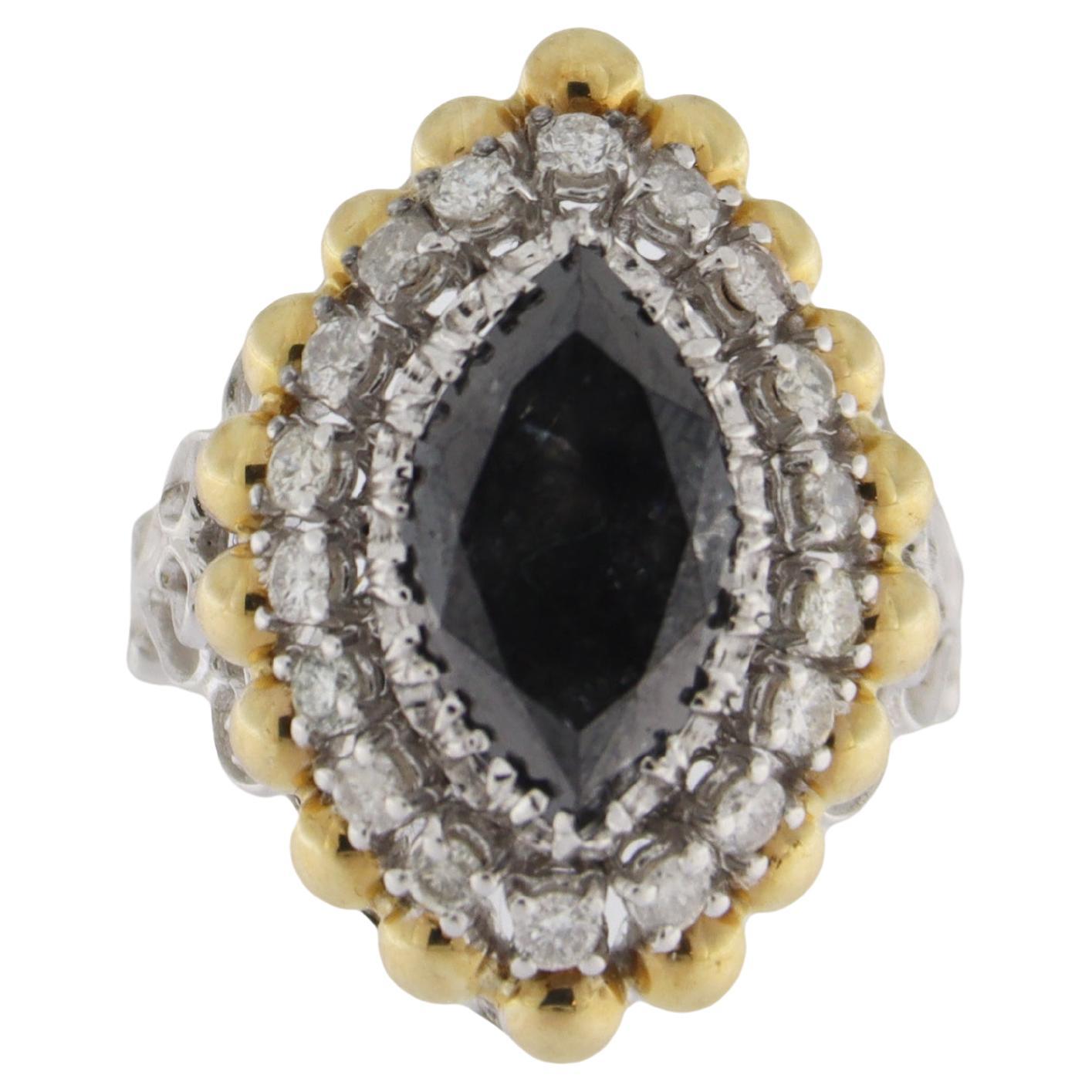 This exquisite ring is a masterpiece of design and craftsmanship, crafted in a sophisticated combination of 18kt white and yellow gold. At its heart lies a striking navette-cut black diamond, weighing an impressive 3.68 carats, exuding mystery and