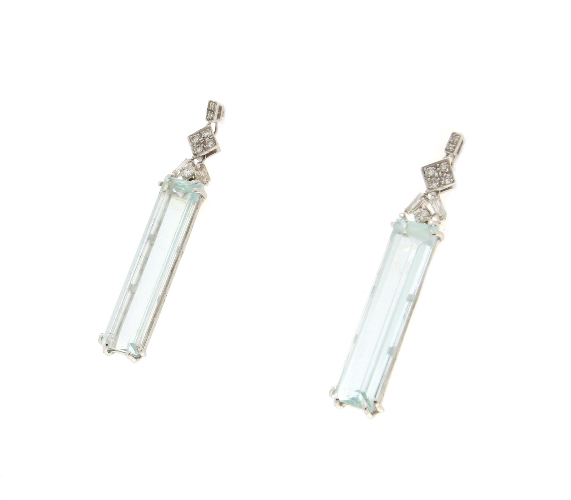 18 karat white gold drop earrings. Handmade by our artisans assembled with Brazilian aquamarine and diamonds

Earrings total weight 7.50 grams
Aquamarine weight 16.11 Karats
Diamonds weight 0.44 Karats