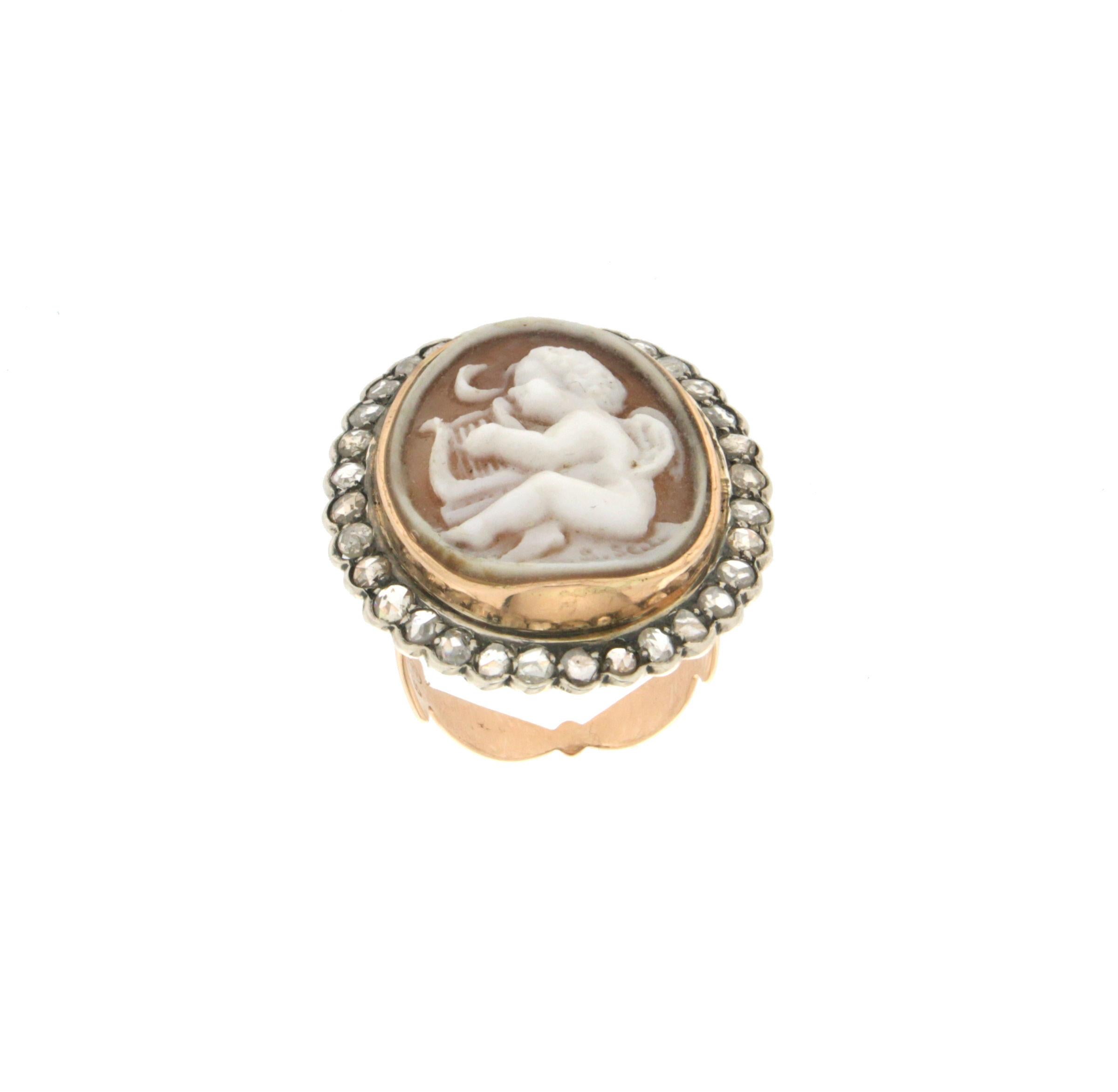 14 karat yellow gold and silver cocktail ring. Handmade by our artisans assembled with cameo and rose cut diamonds

Diamonds weight 1.46 karat
Ring total weight 2.60 grams
Ring size 8 US 17 Ita
