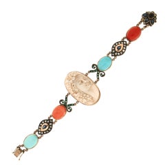 Bracelet manchette artisanal camée en corail, or jaune 9 carats, turquoise et diamants