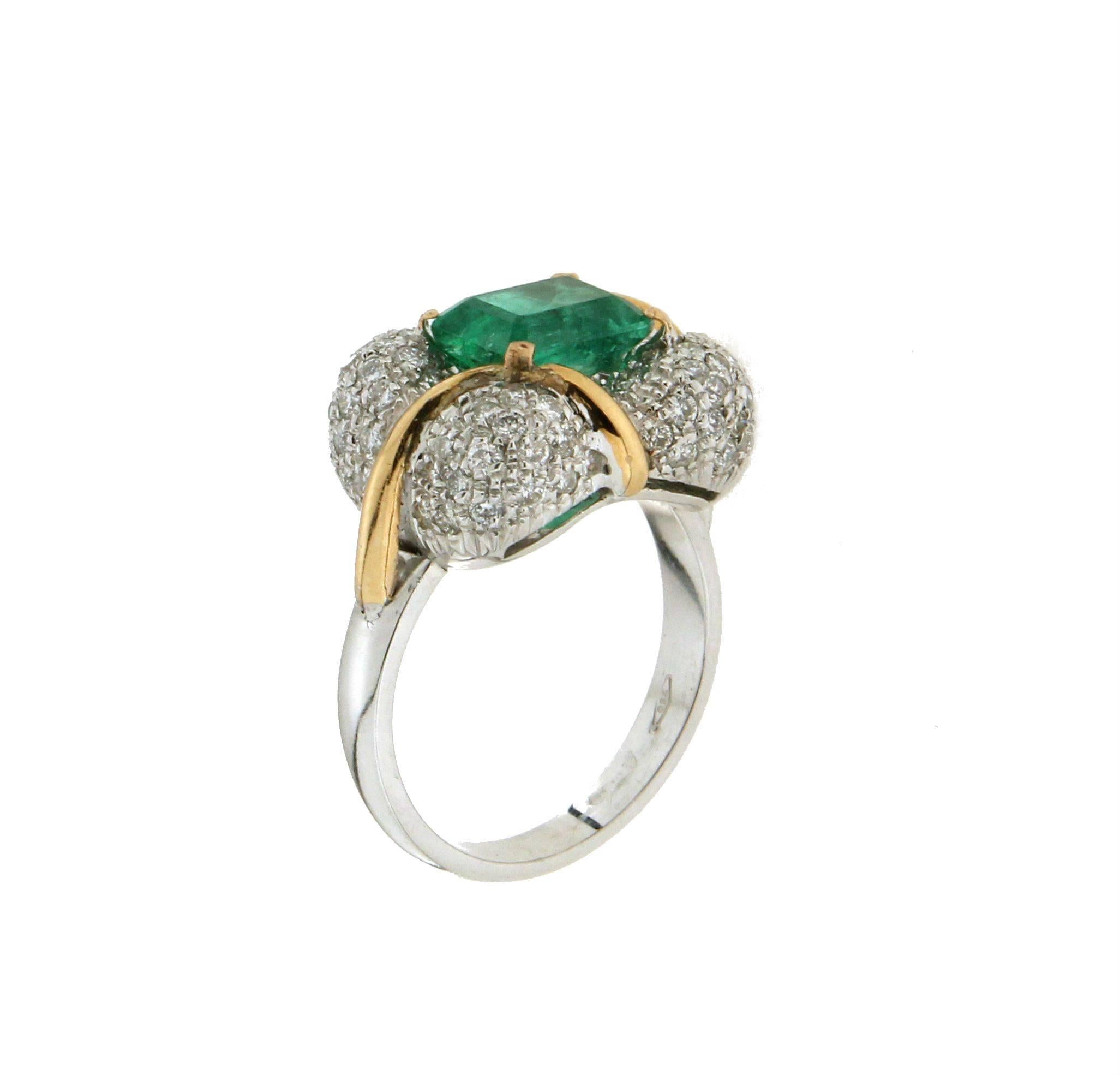 This magnificent 18K white gold cocktail ring is a true masterpiece of fine jewelry, featuring a 2.35 carat Colombian emerald center stone and an exquisite combination of 1.22 carat brilliant-cut diamonds. Its striking design radiates luxury and