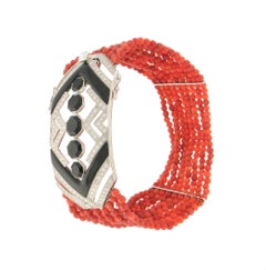 Bracciale artigianale in corallo, oro bianco 18 carati, diamanti e onice