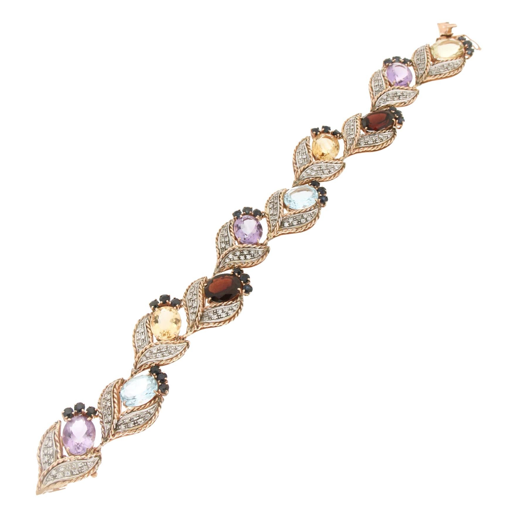 Bracelet manchette artisanal en or jaune et blanc 14 carats avec diamants et saphirs