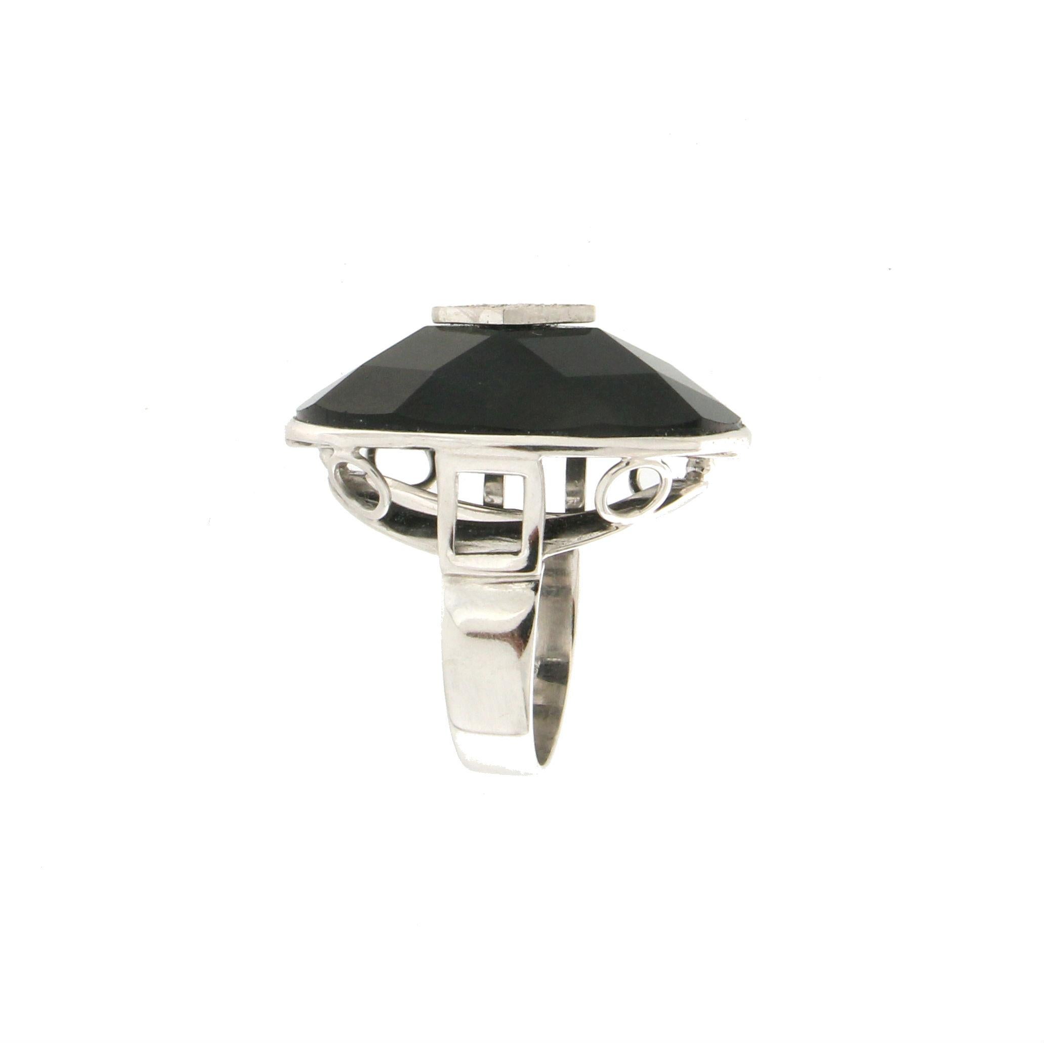 18 karat white gold cocktail ring. Handmade by our artisans assembled with diamonds and black onyx.

Diamonds weight 0.09 karat
Ring total weight 15.40 grams
Ring size 7.80 US 16 Ita
(all rings are can be resized)