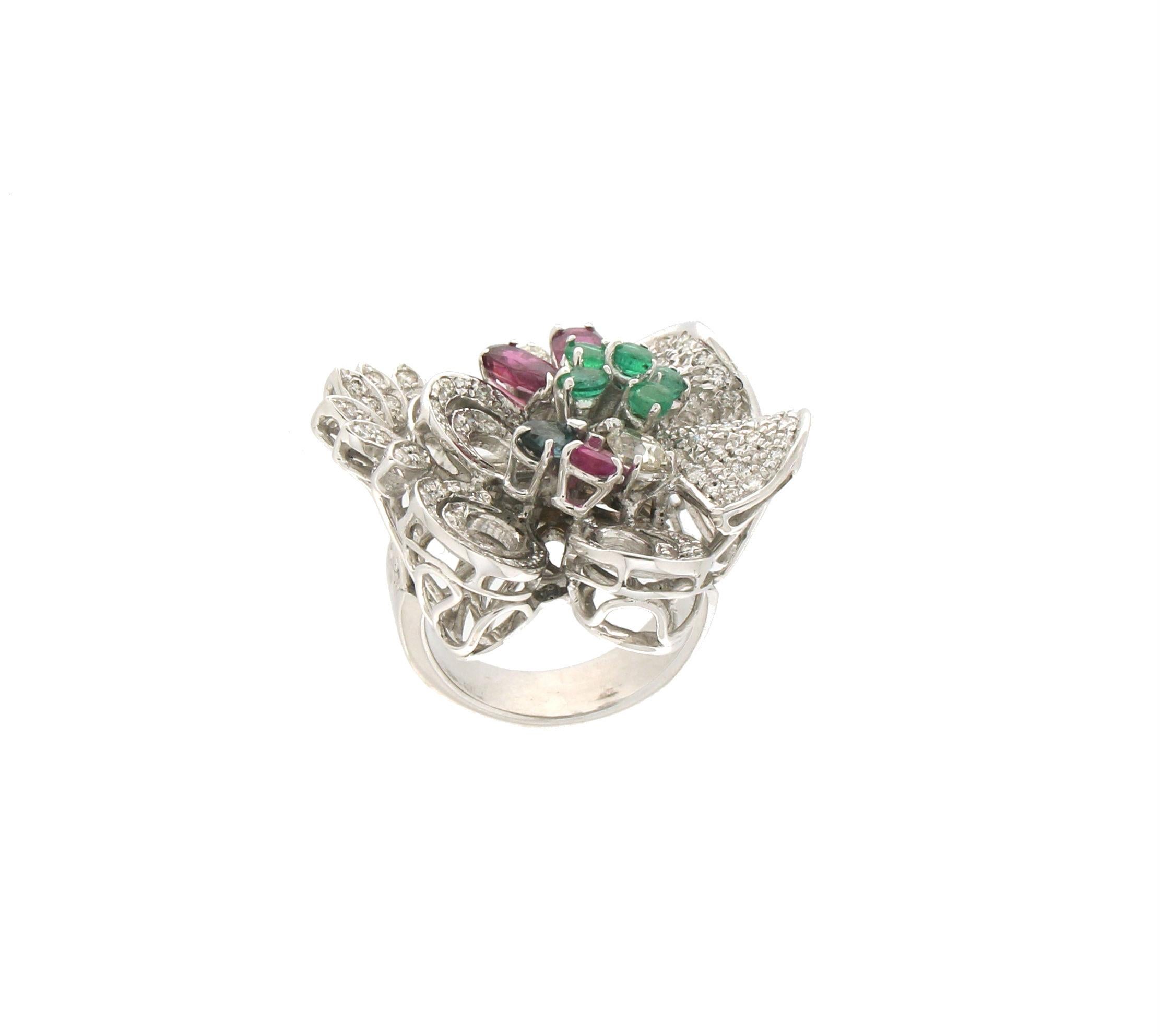 18 karat white gold cocktail ring. Handmade by our artisans assembled with diamonds,sapphires,rubies and emeralds

Diamonds weight 1.35 karat
Ruby,sapphires,emeralds total weight 3
Ring total weight 25.70 grams
Ring size 8.50 US 17.80 Ita
(all rings