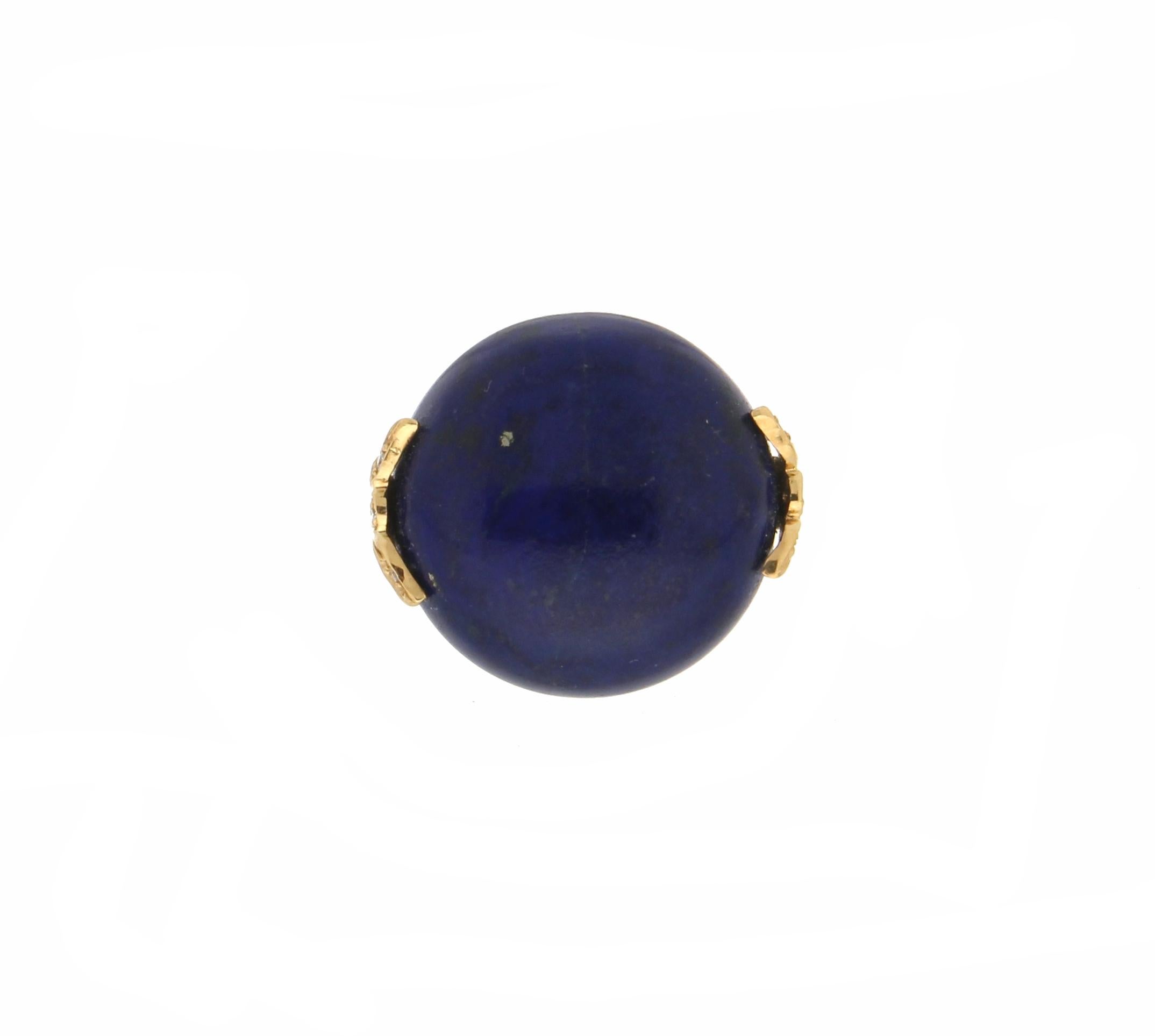 18 karat yellow gold cocktail ring. Handmade by our artisans assembled with lapis lazuli and diamonds.

Ring total weight 15.40 grams
Diamonds weight 0.05 karat
Lapis lazuli weight 8.50 grams
Ring size 16.50 Ita 7.75 Us
(all rings are can be resized)