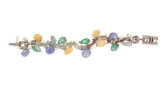 Bracelet manchette artisanal en or blanc 18 carats et diamants multicolores