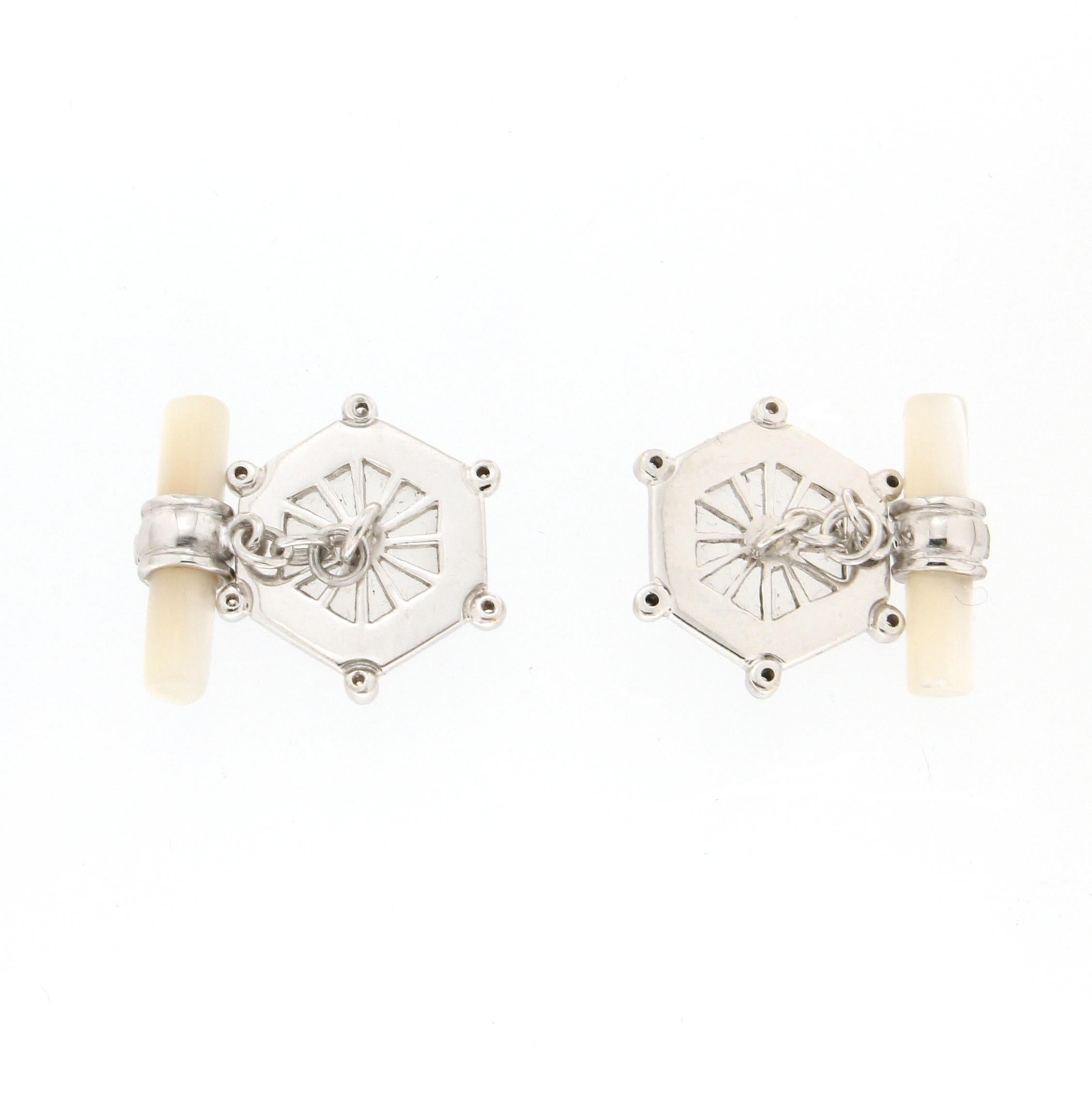 18 Karat white gold cufflinks. Handmade by our craftsmen and assembled with mother-of-pearls barrels,diamonds and rock crystal

Cufflinks total weight 11.40 grams
Diamonds weight 0.10 karat

