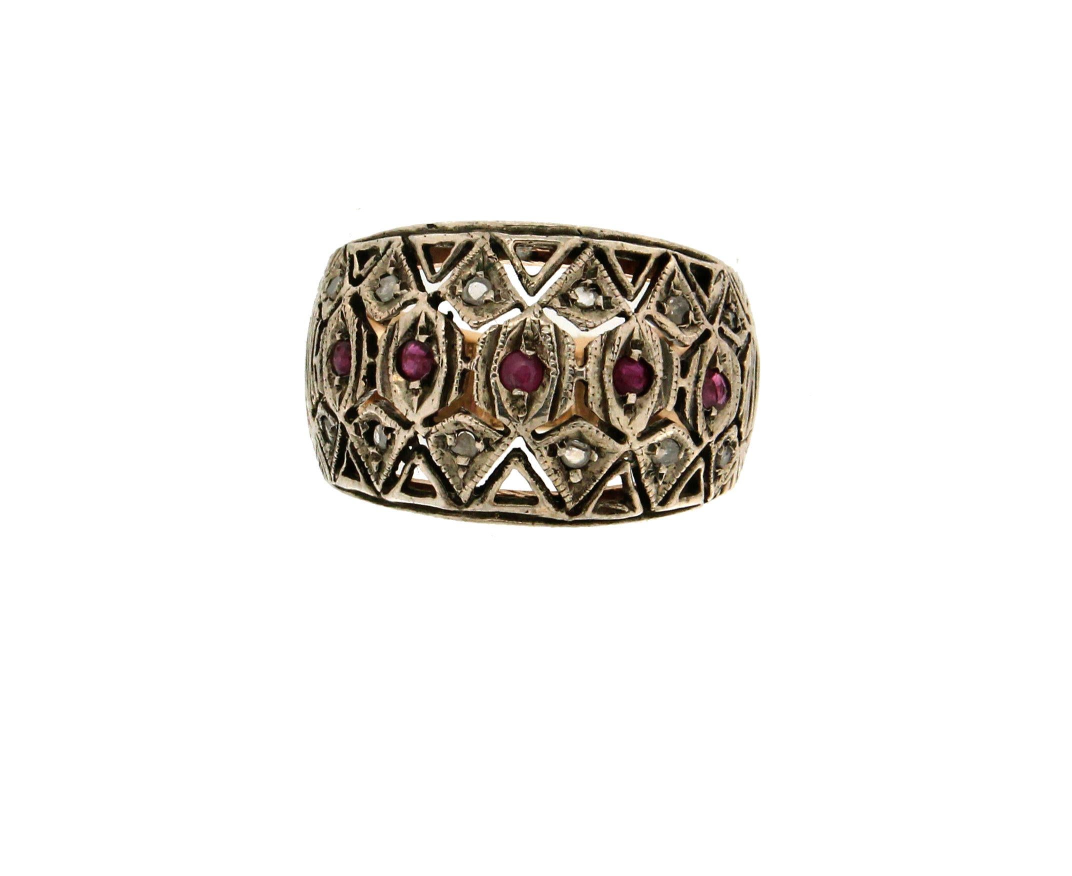 14 Karat yellow gold and silver cocktail ring. Handmade with ruby and diamonds.

diamonds weight 0.31 karat
Ruby weight 0.15 karat
Ring total weight 7.20 grams
Ring size ITA 16 - US 7.75