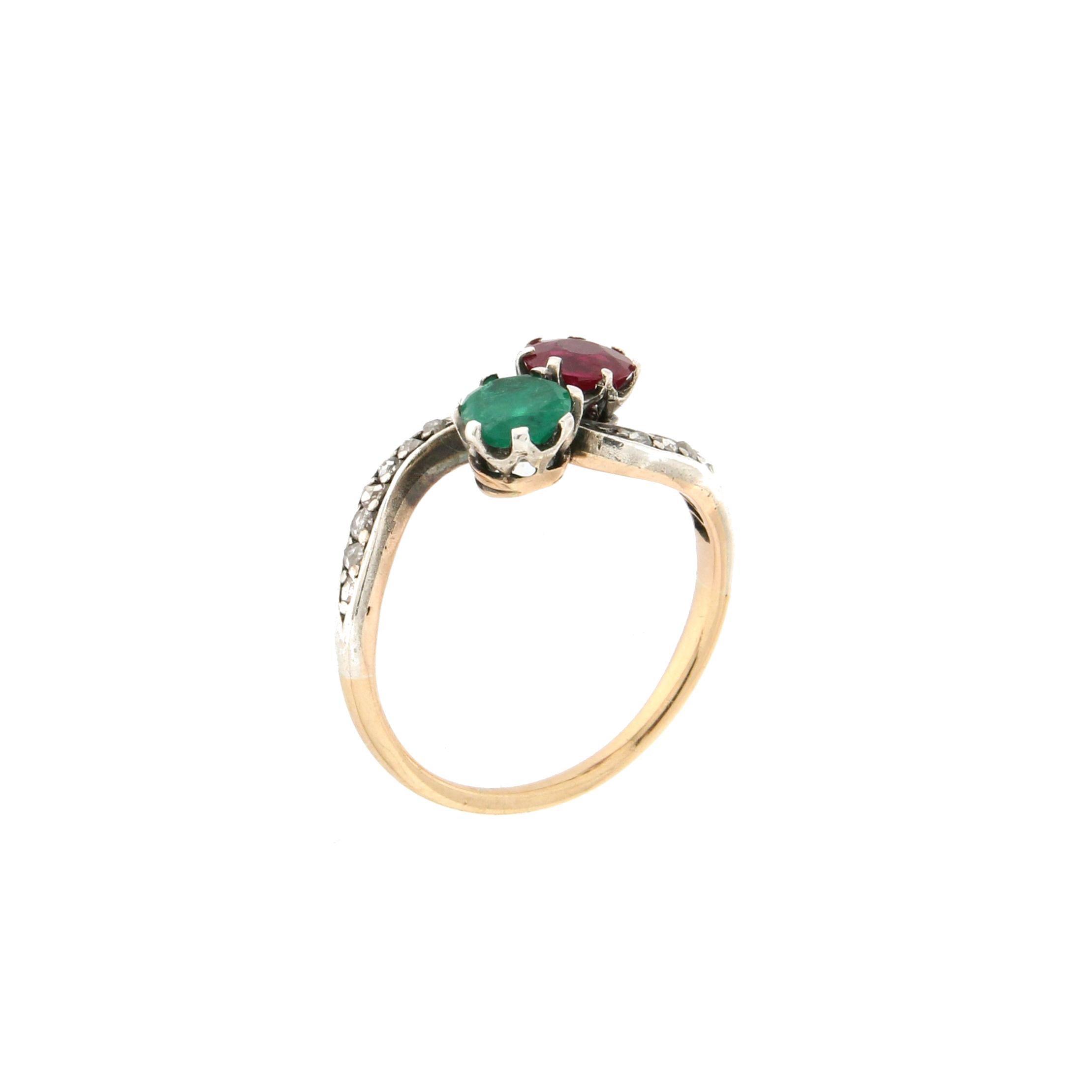 14 karat yellow gold and 800 karat silver cocktail ring. Handmade by artisans assembled with old cut diamonds, ruby and emerald.

Ring total weight 2.60 grams
Ruby and emerald total weight 1.17 karat
Ring size 7.25 US 15 Ita
(all rings are can be