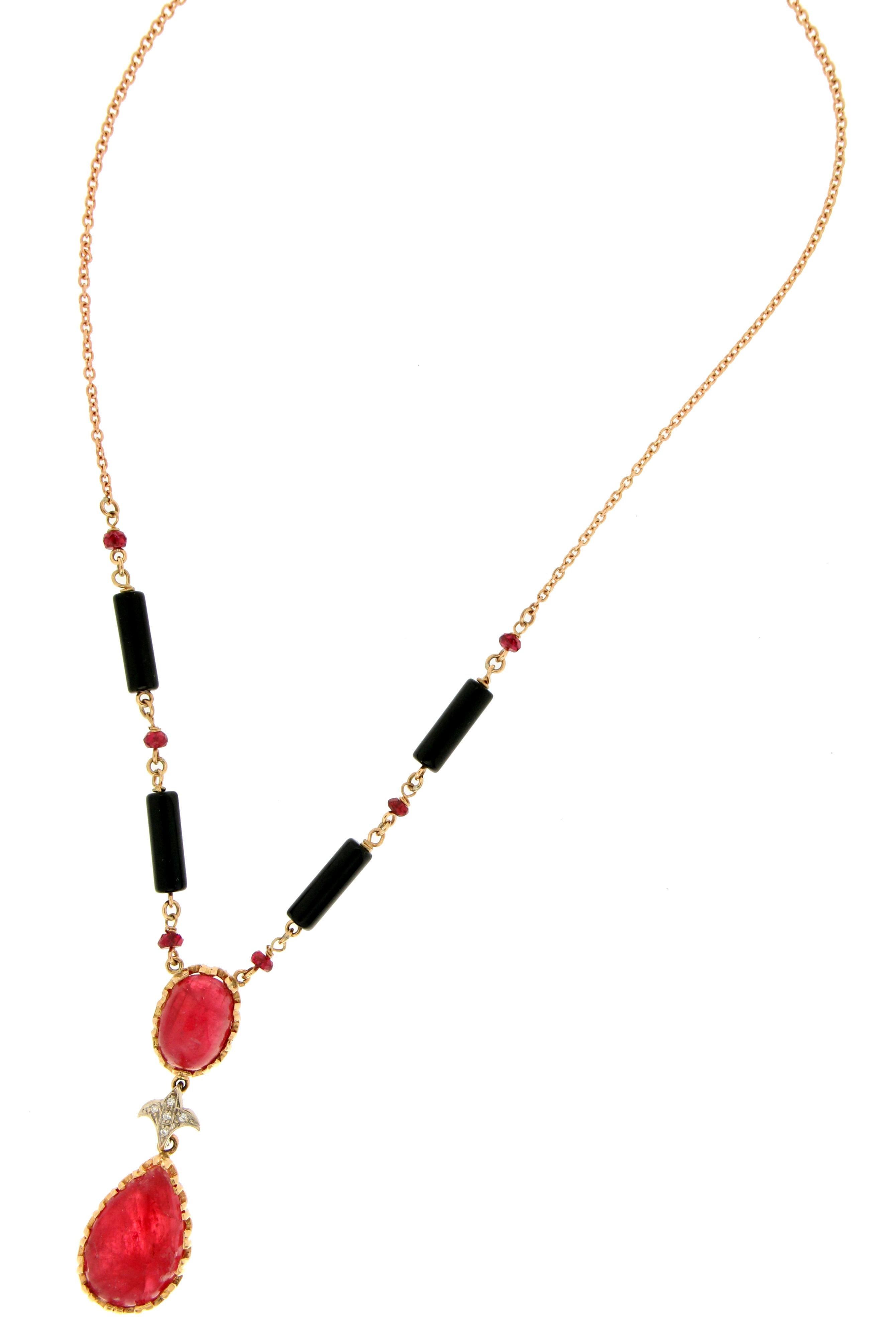 14 karat yellow gold pendant necklace. Handmade by our craftsmen and assembled with barrels onyx,diamonds,round ruby and drop ruby

Chain size 41 cm 
Barrels onyx size 13 mm (length)
Drop Ruby size 19 mm (length) 14 mm (width)
Diamonds weight 0.05