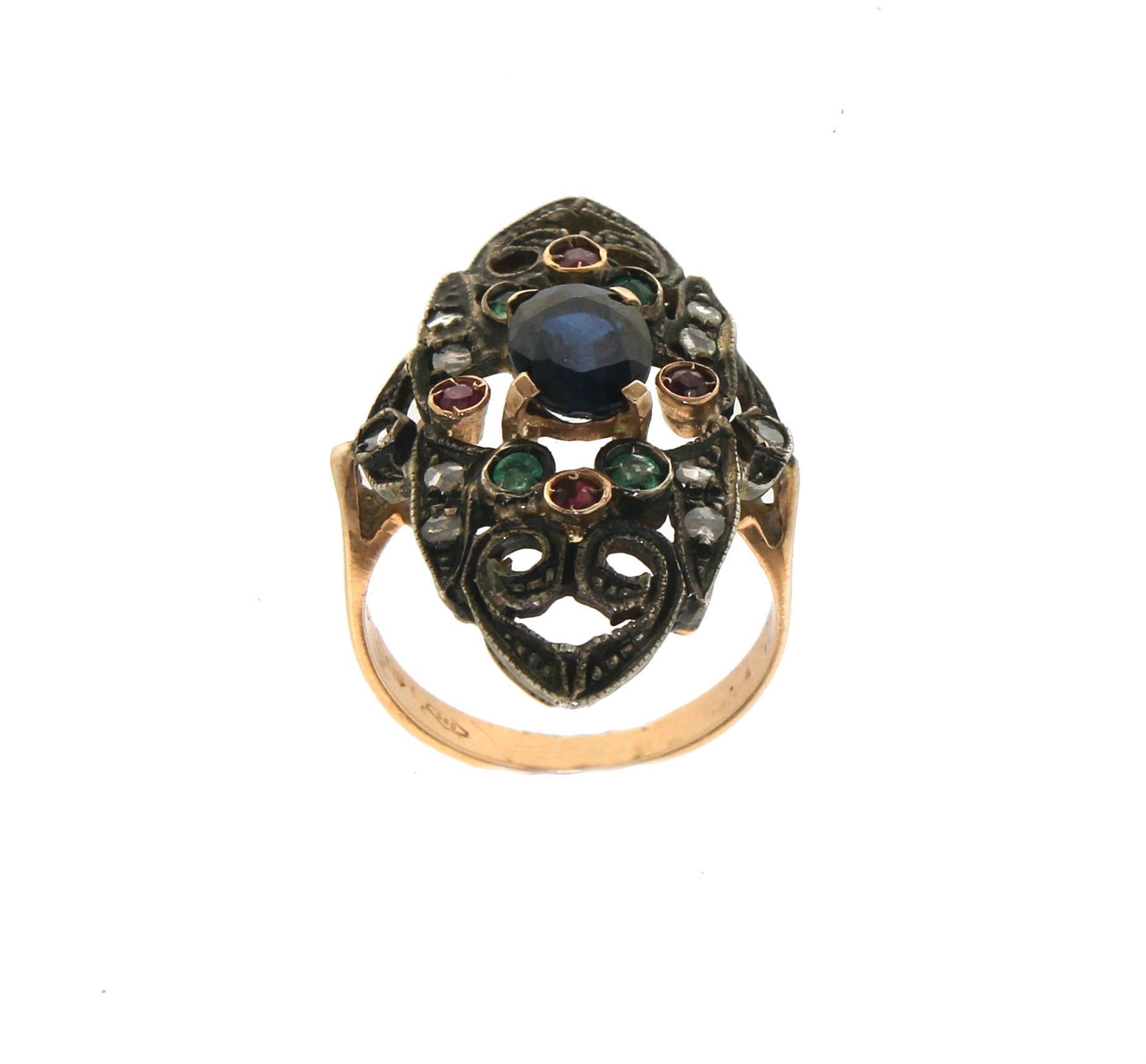 14 karat yellow gold and 800 thousandths silver cocktail ring. Handmade by artisans assembled with old diamonds, sapphires,ruby and emeralds.

Ring total weight 6.30 grams
Ring size 8.10 US 16.90 Ita
(all rings are can be resized)