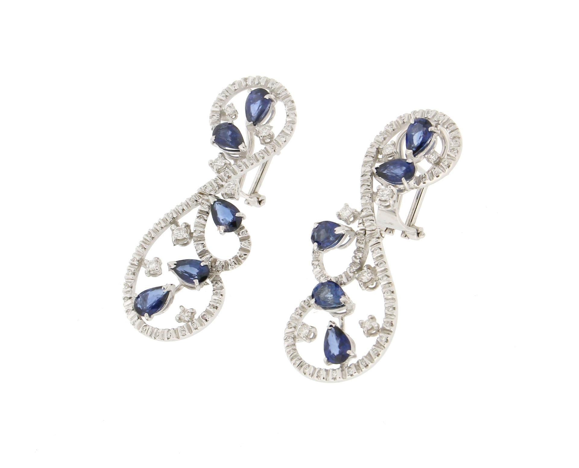 Beautiful earrings 18 karat white gold mounted with sapphires drop and diamonds,in the lower part the earring is movable.
Earrings created by our craftsmen.

Earrings total weight 13.90 grams
Diamonds weight 0.86 karat 
Sapphires weight 4.90 karat